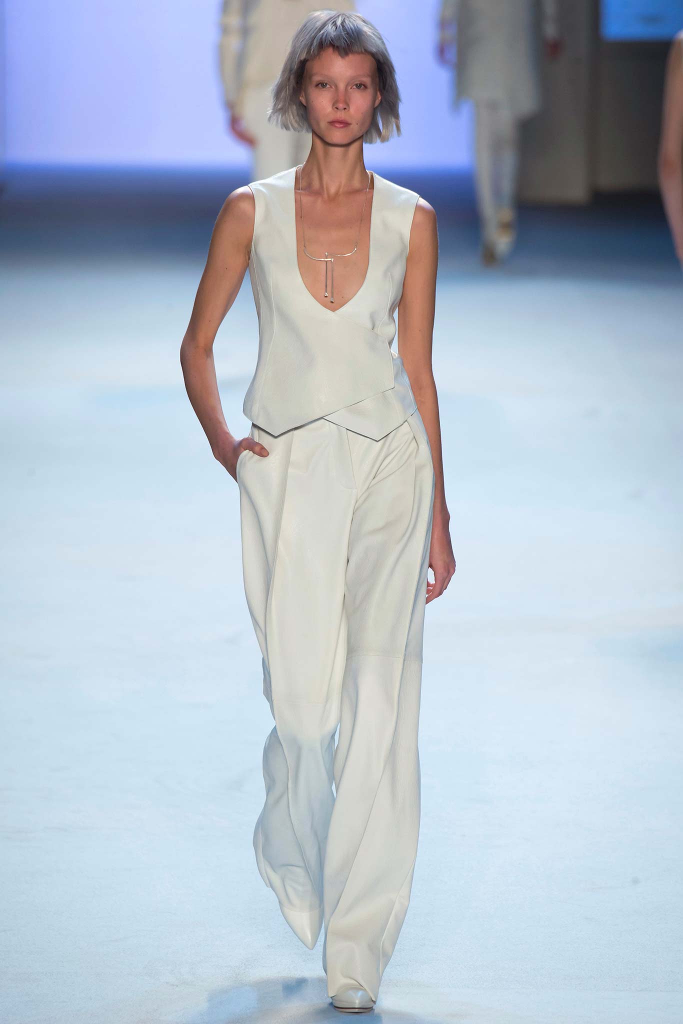 white silk fitted top and relaxed pants