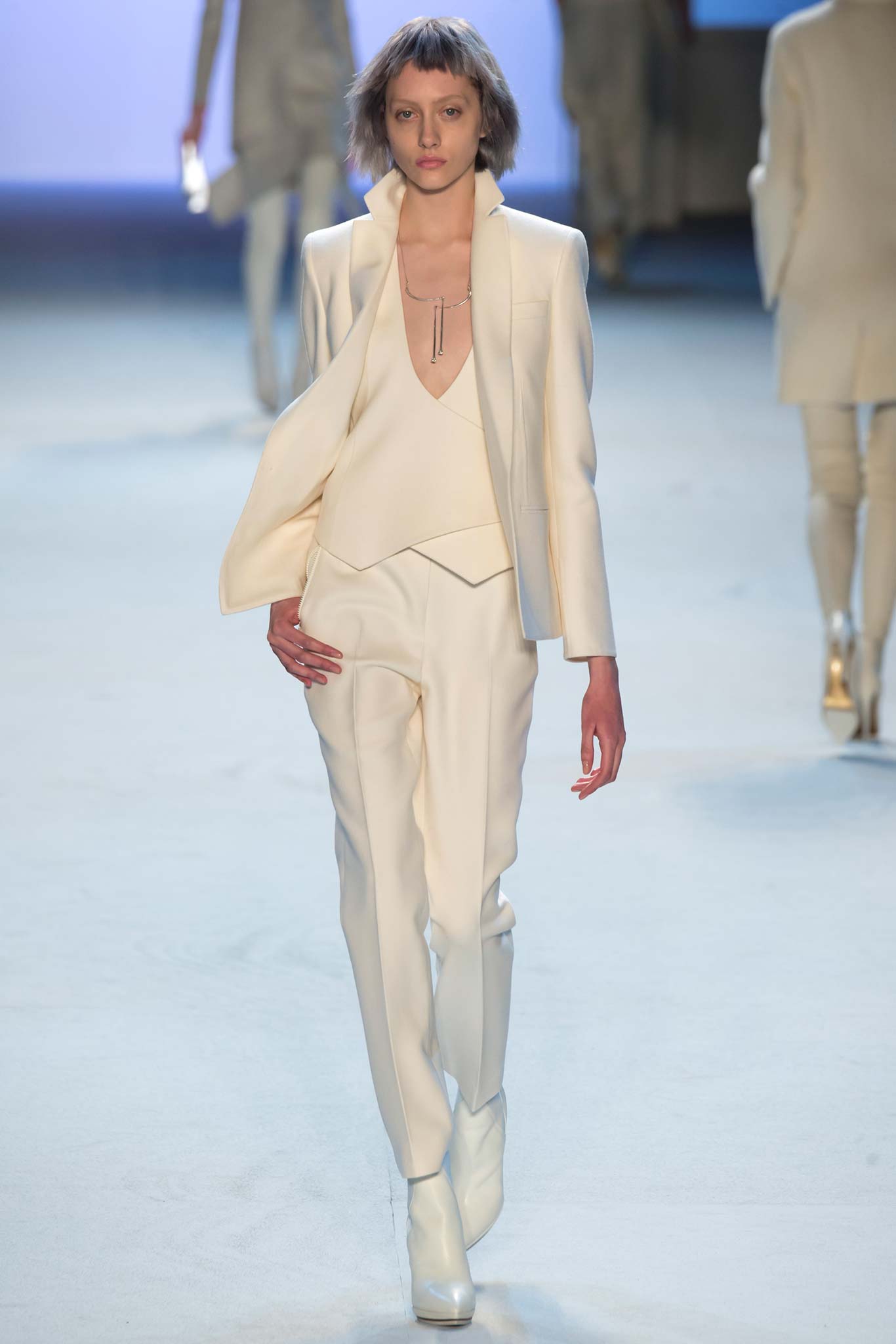 white tailored suit with boots