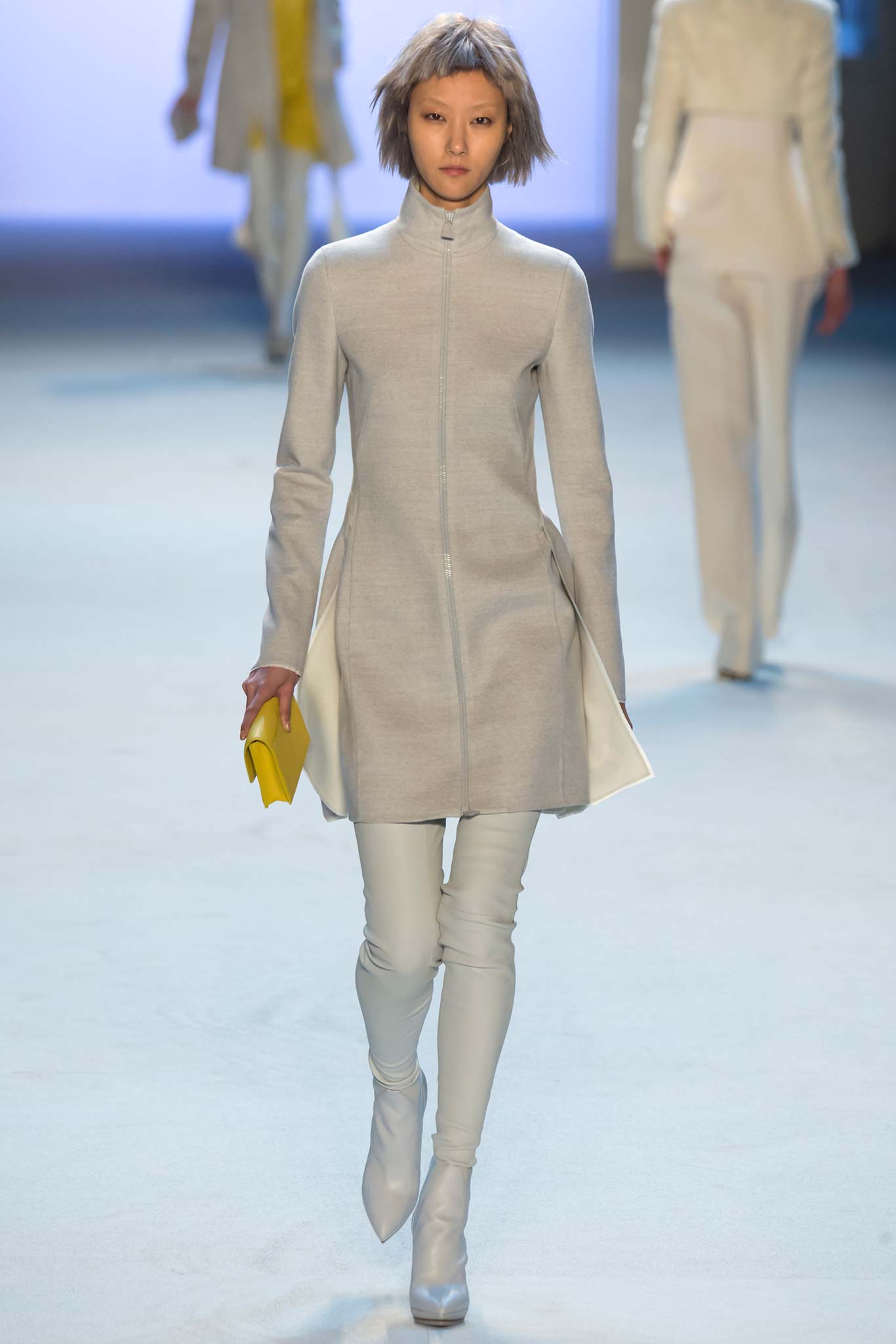 gray wool fitted coat with white pants