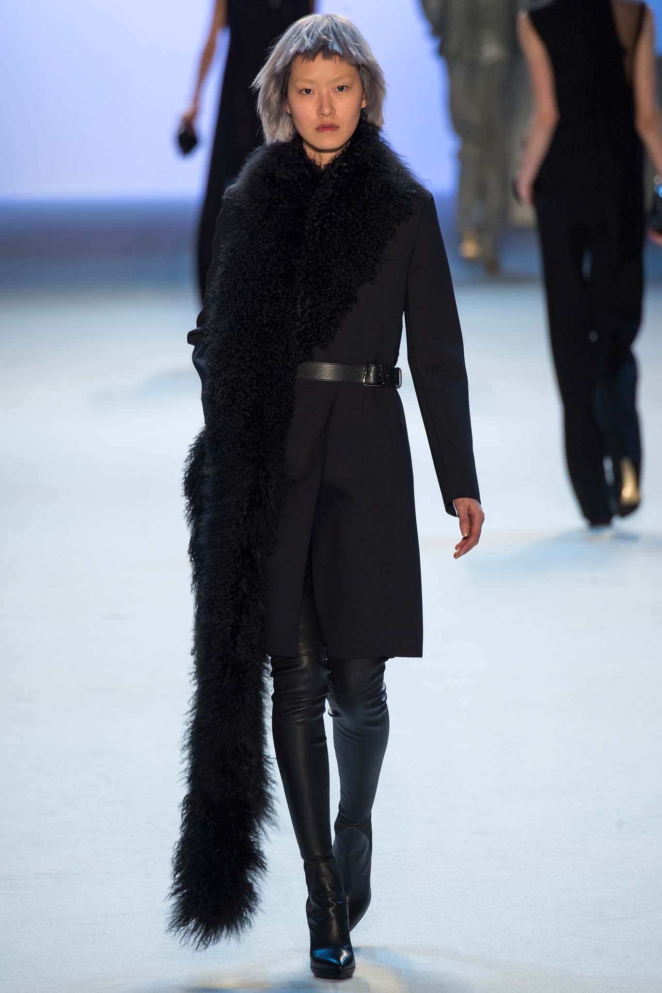 black fitted coat and leather pants