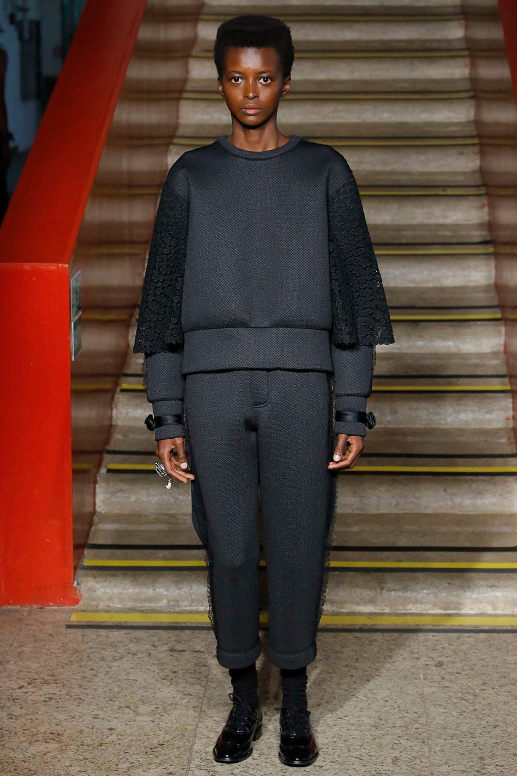 black fitted sweater and pants