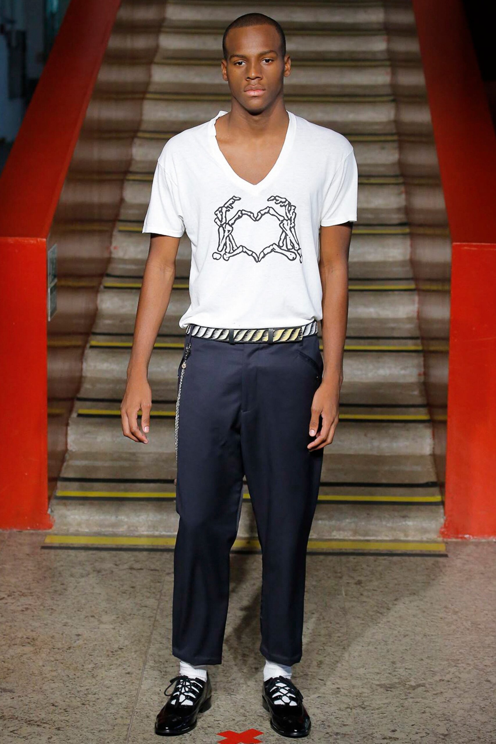 white fitted t-shirt and navy tailored pants
