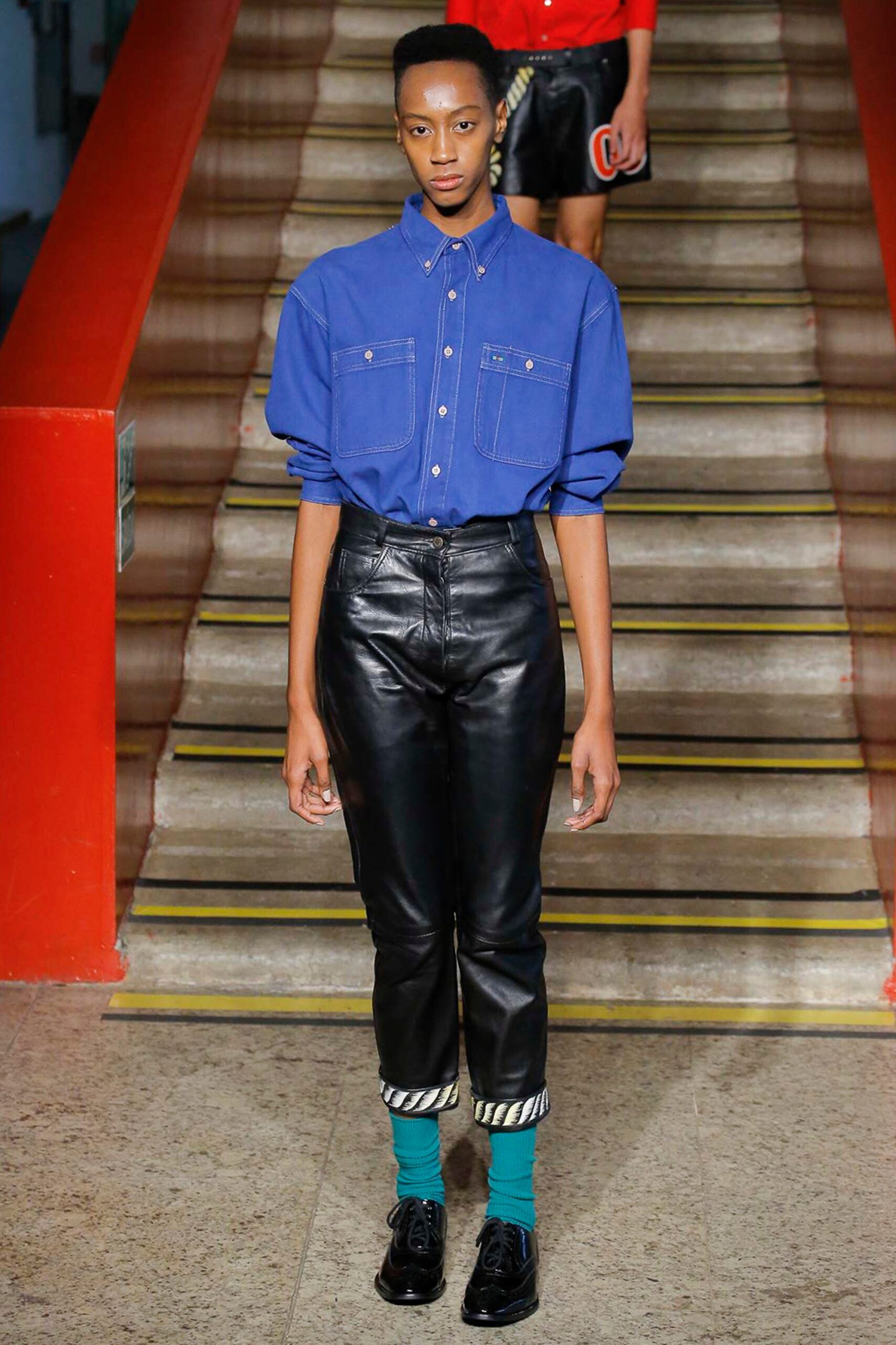 blue oversized shirt and black leather pants