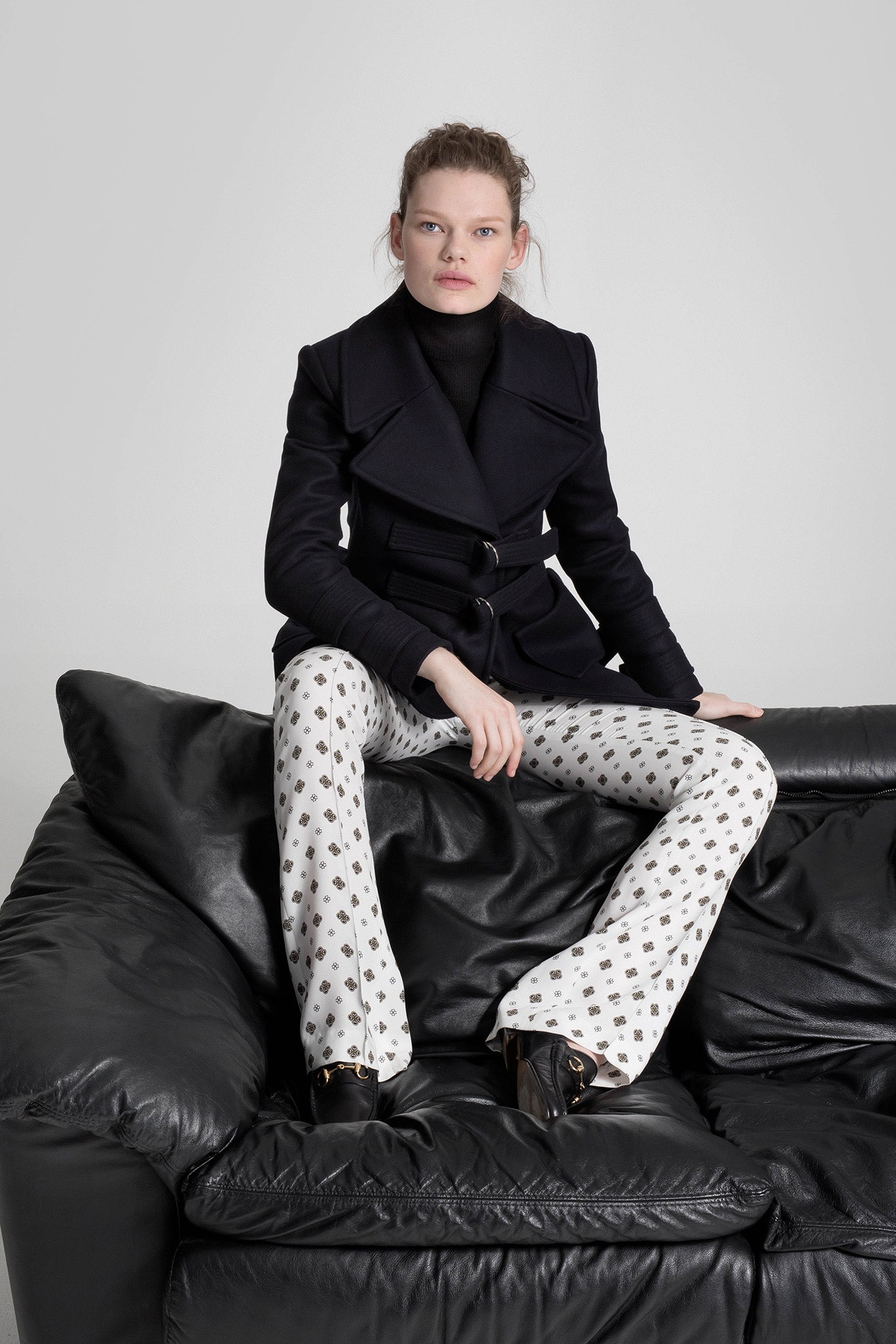 black wool coat and printed pants