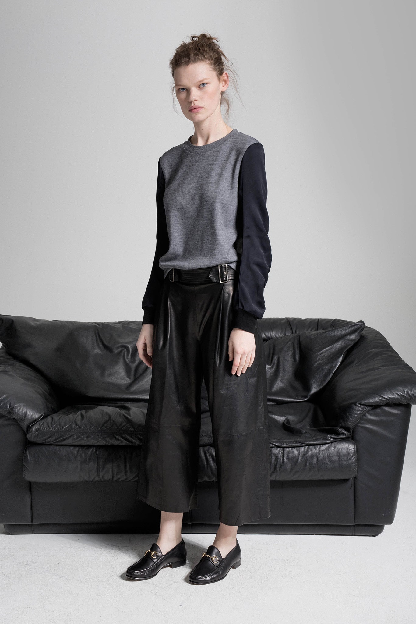 gray top black leather pants