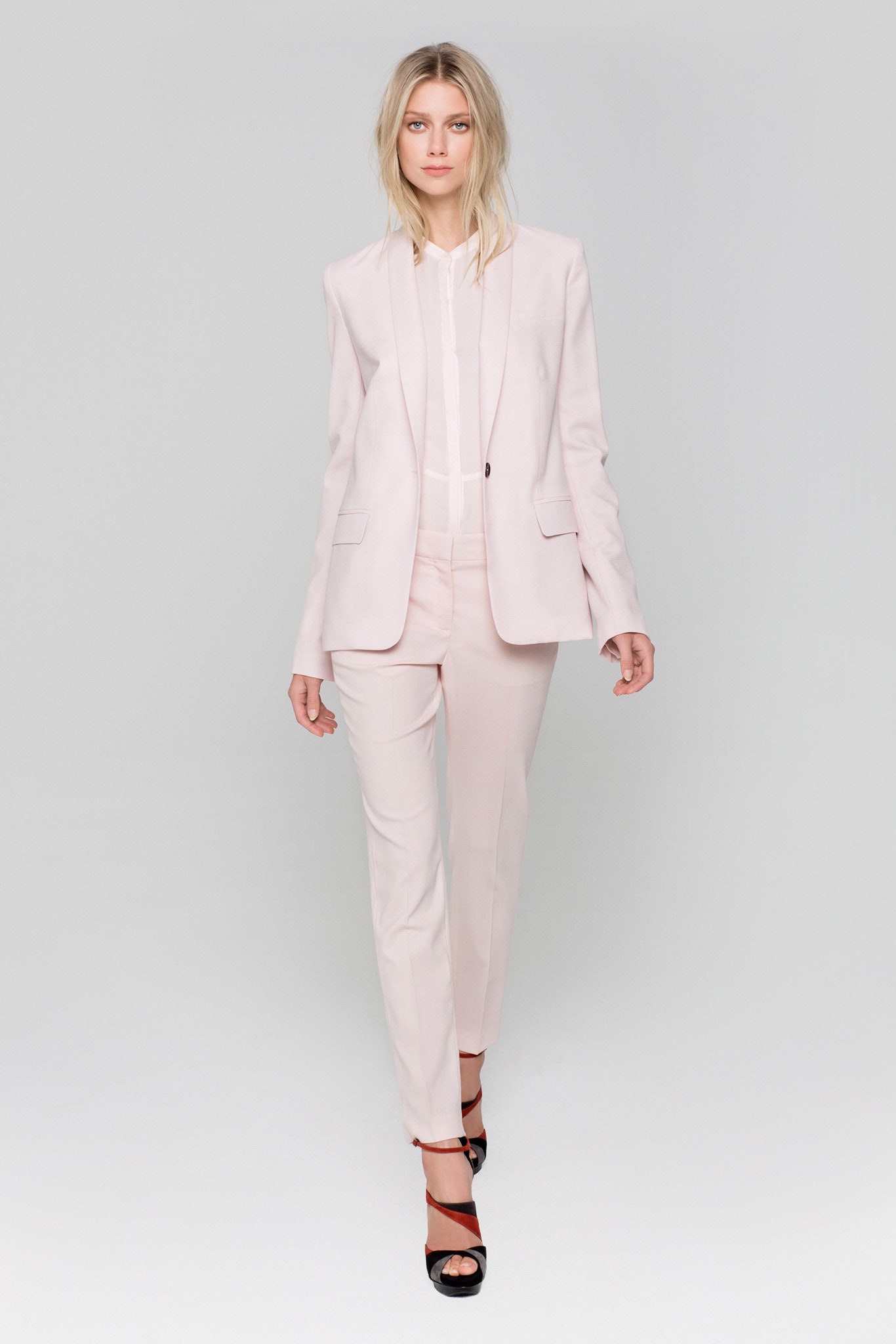 pink tailored suit with white shirt