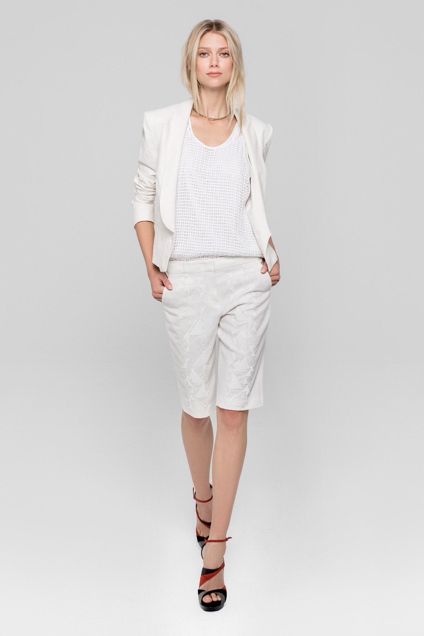 white tailored blazer and shorts