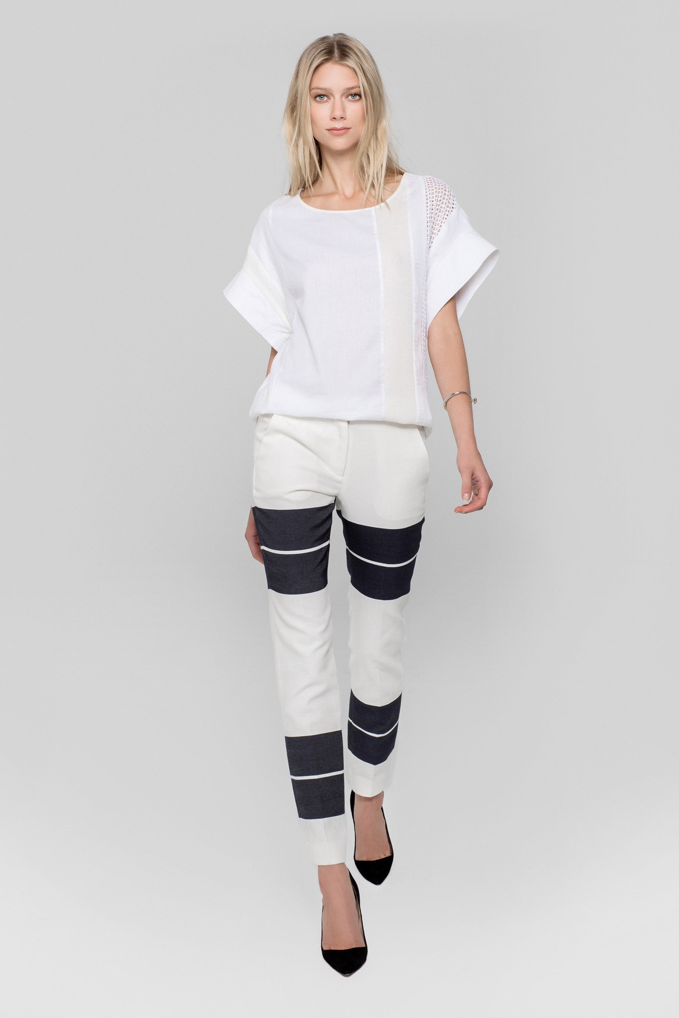 white relaxed top with striped pants