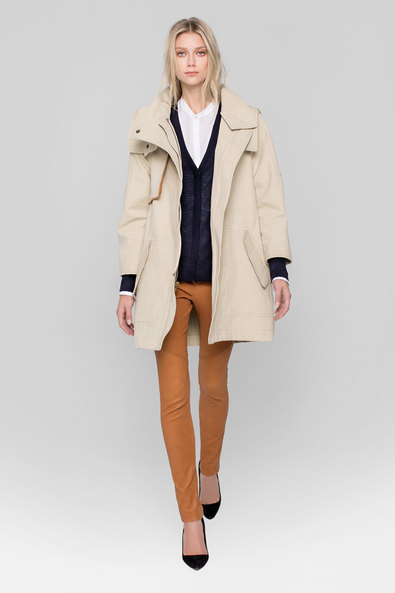 beige coat with navy vest
