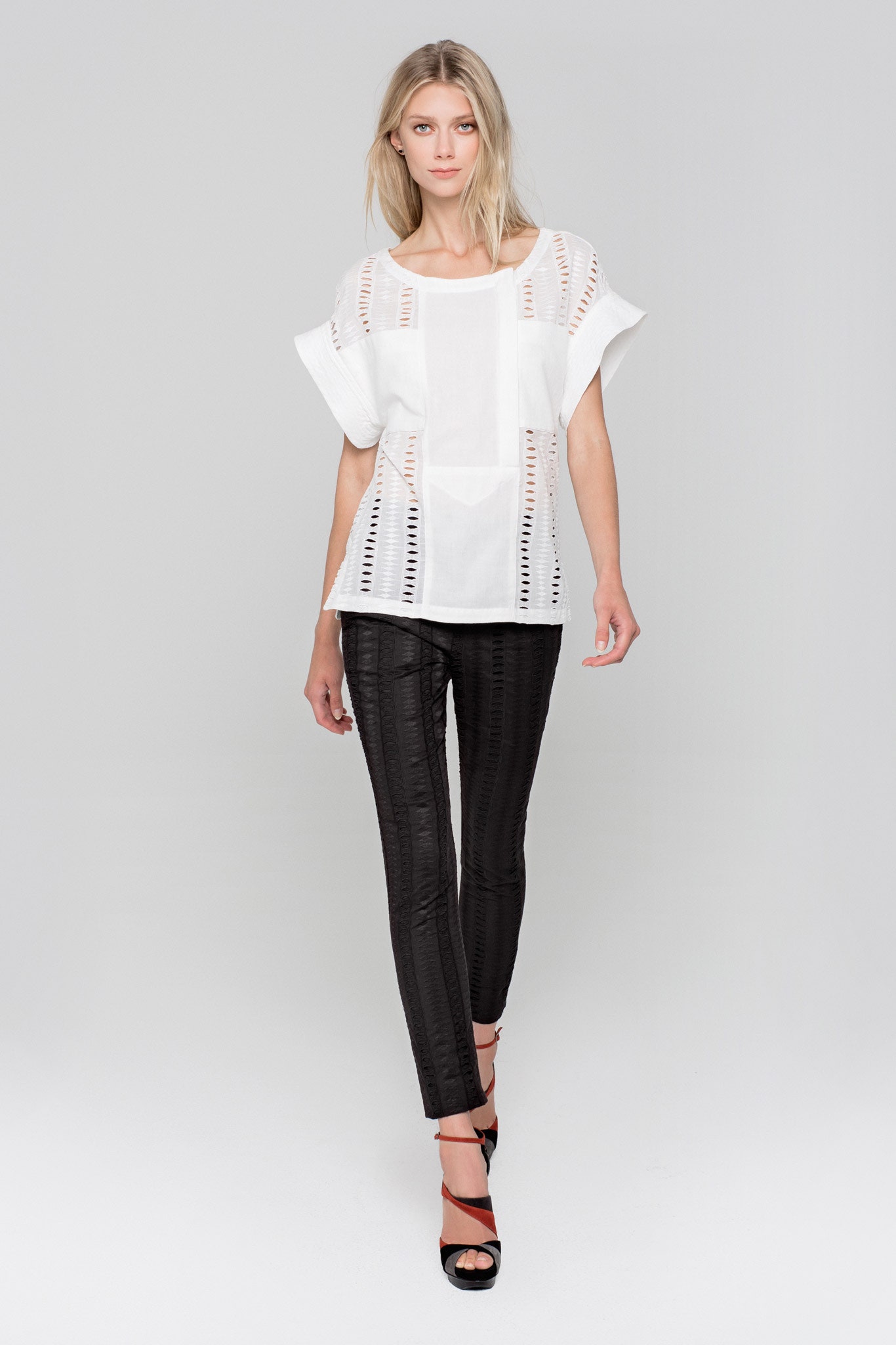 white embroidered top with black pants