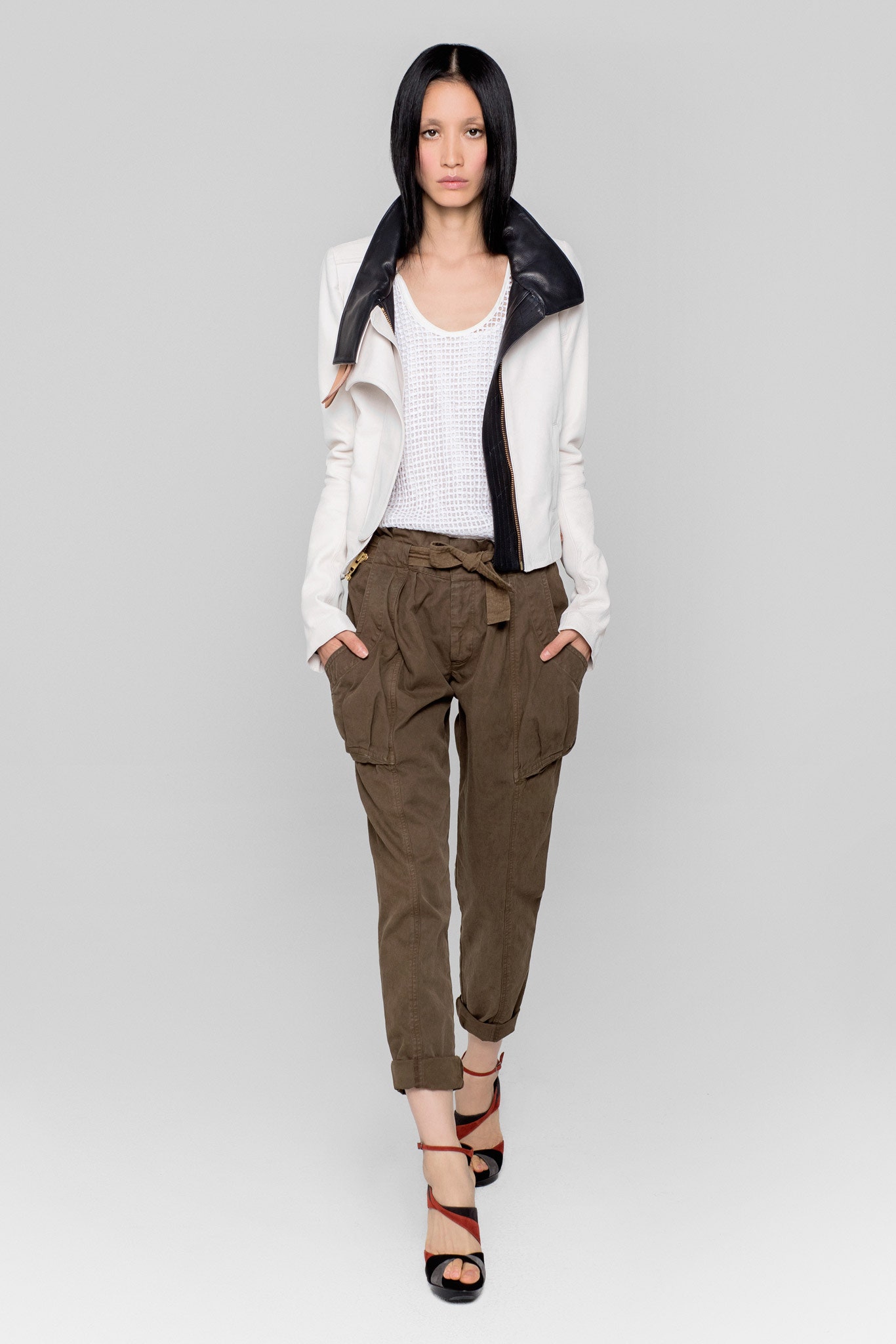 white and black fitted jacket with relaxed top and cargo pants