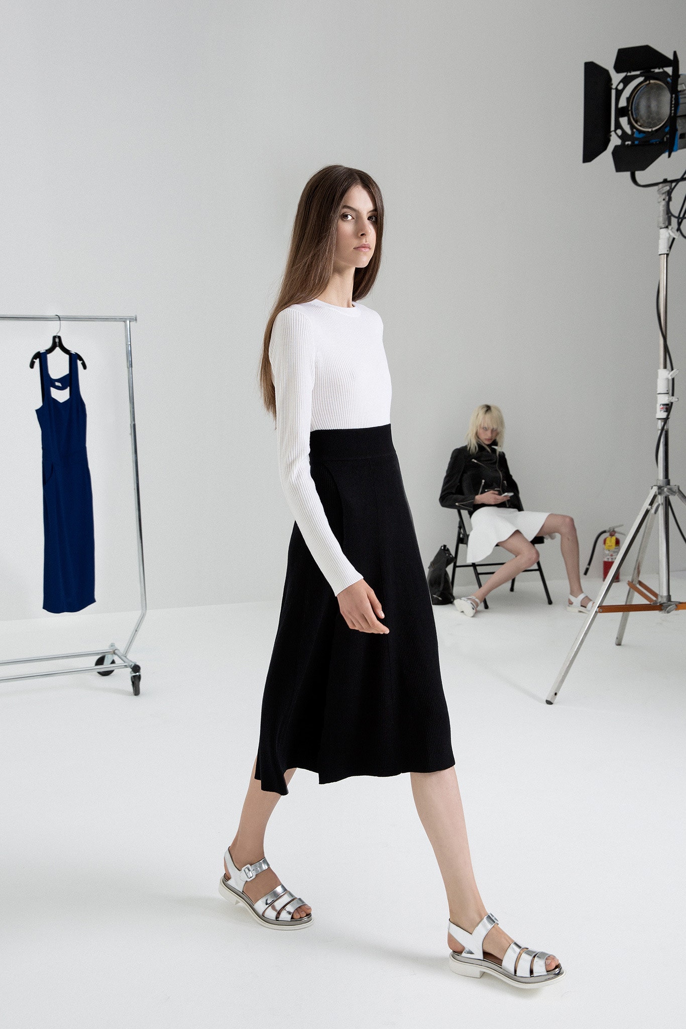 white fitted top black midi skirt