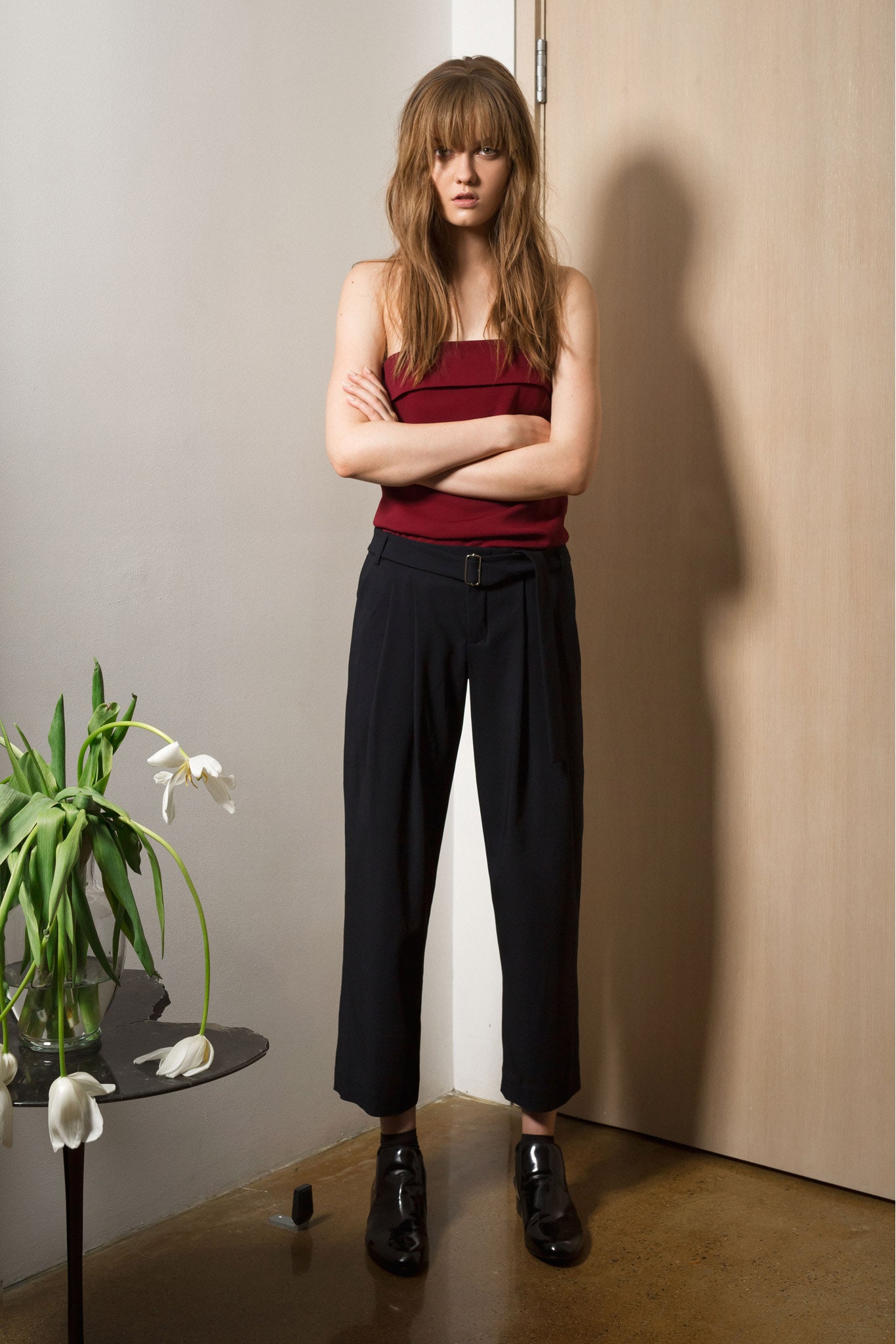 red sleeveless high-neck fitted top