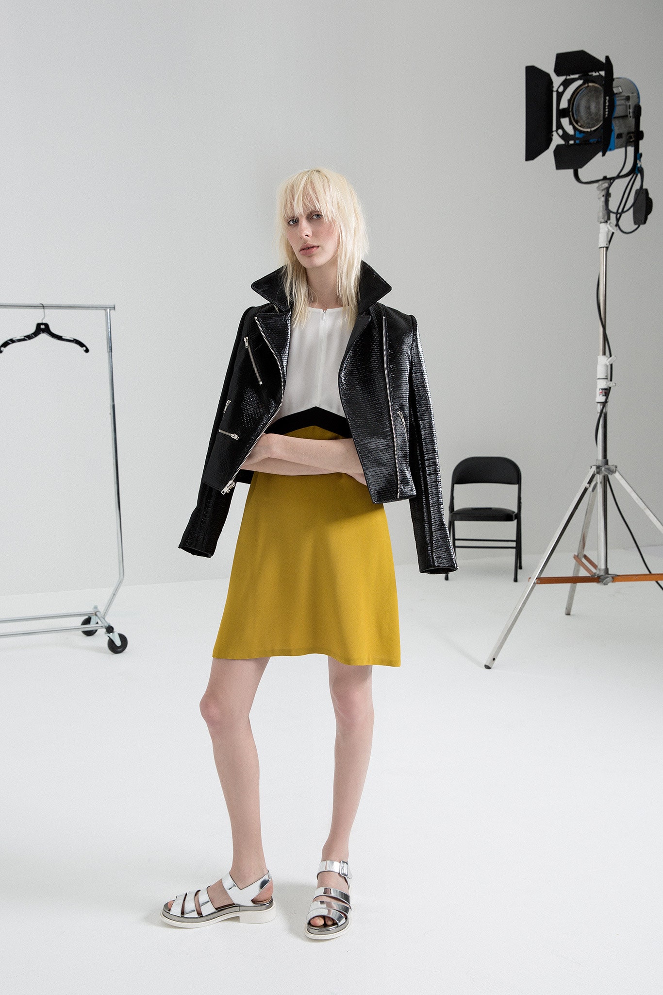 black leather jacket with yellow skirt