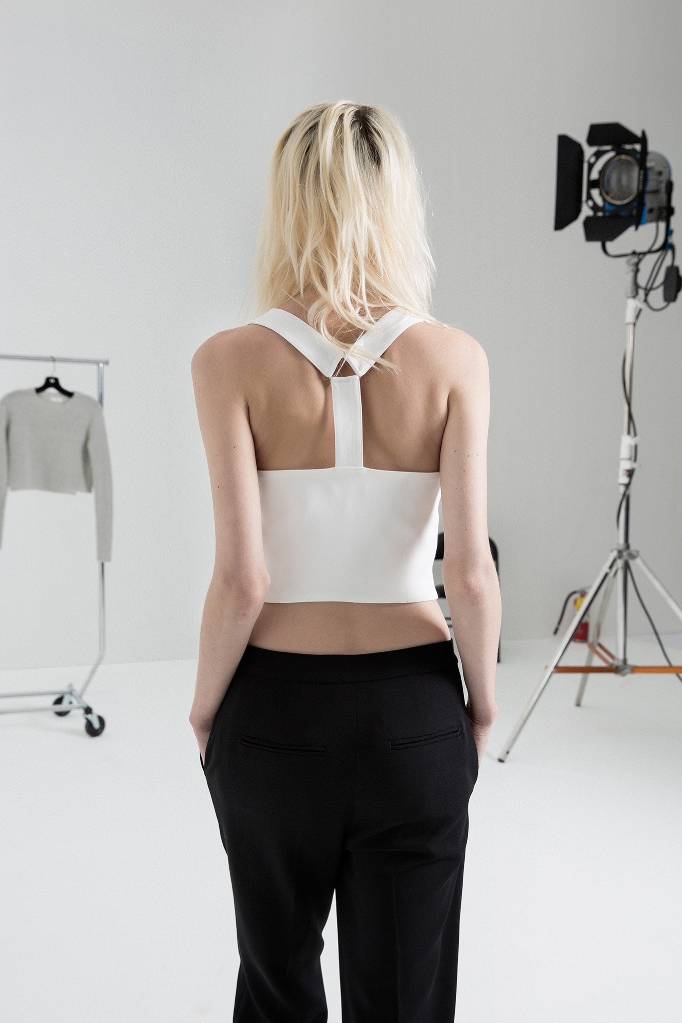 white fitted top and black tailored pants