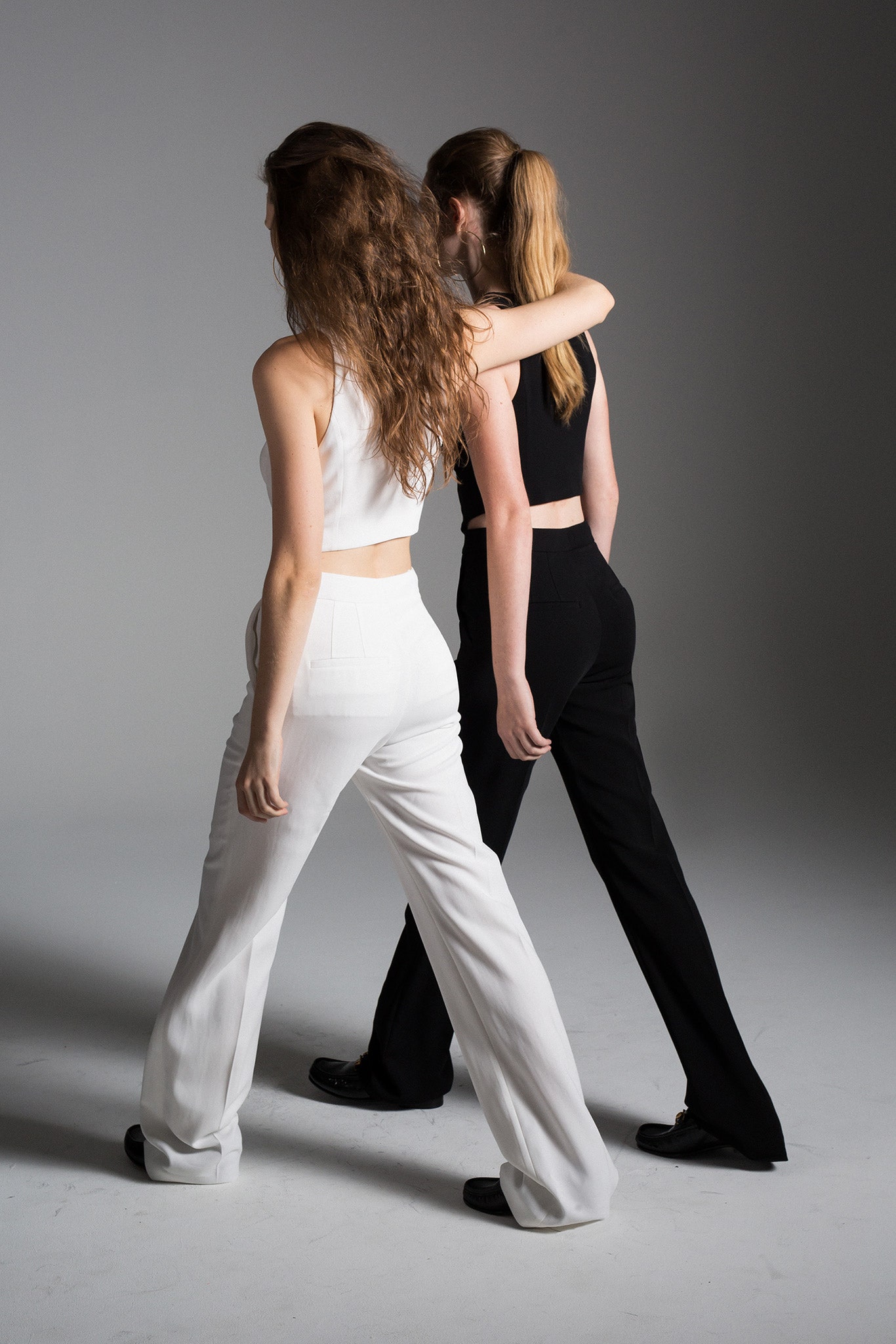 fitted black and white tops with flared pants