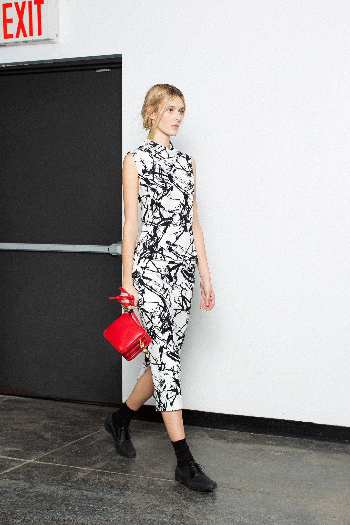 fitted printed midi dress with red bag