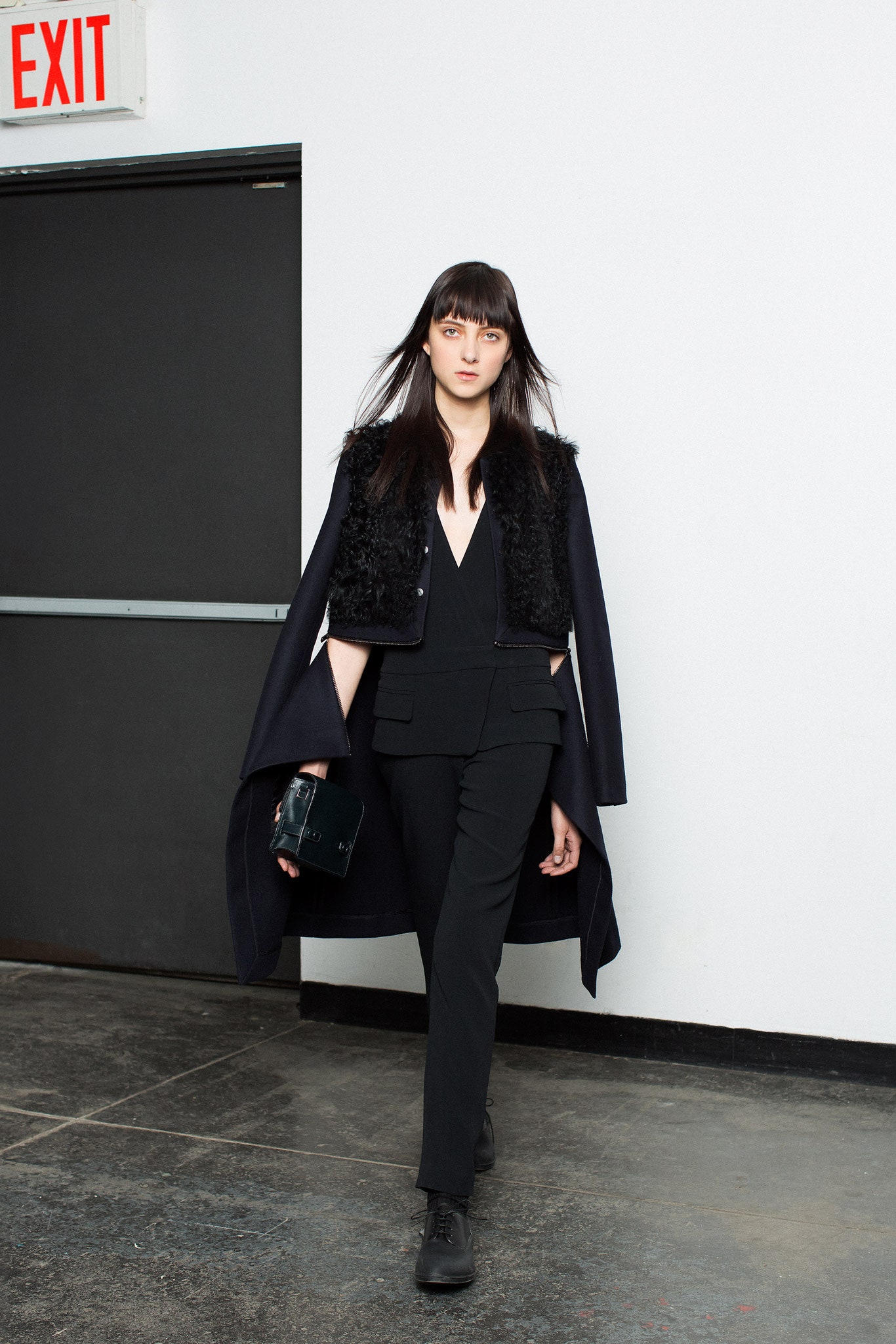 black coat and jumpsuit ensemble