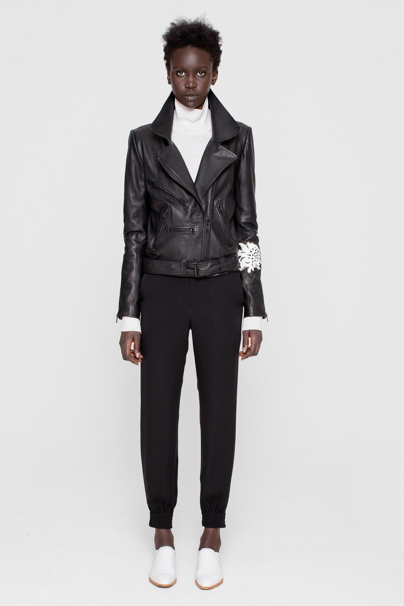 black leather fitted jacket with white top