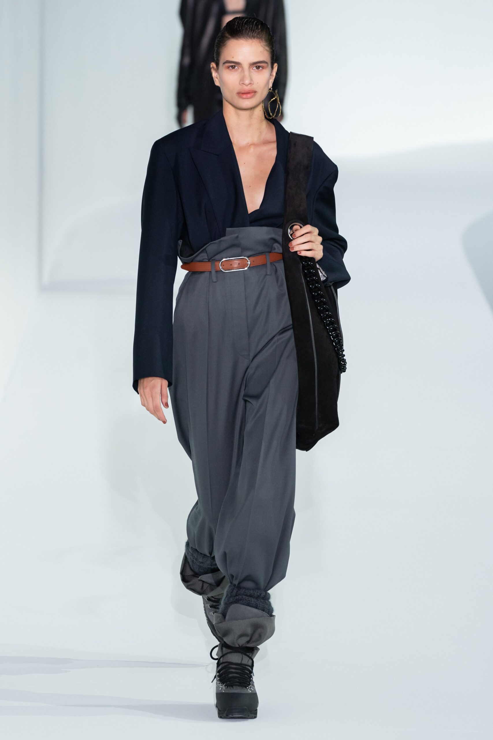 black tailored blazer with gray pants