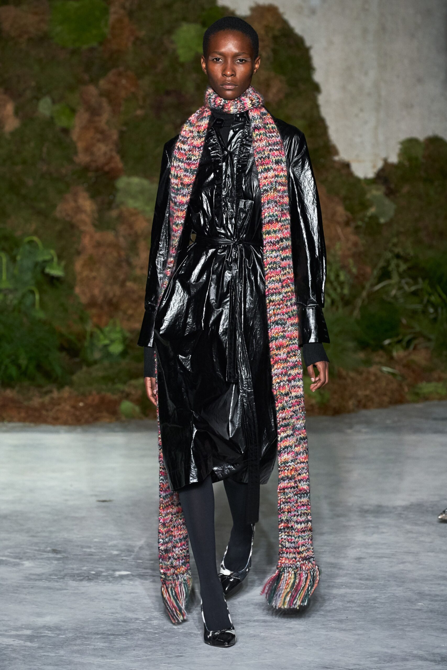 black vinyl fitted coat with multi scarf