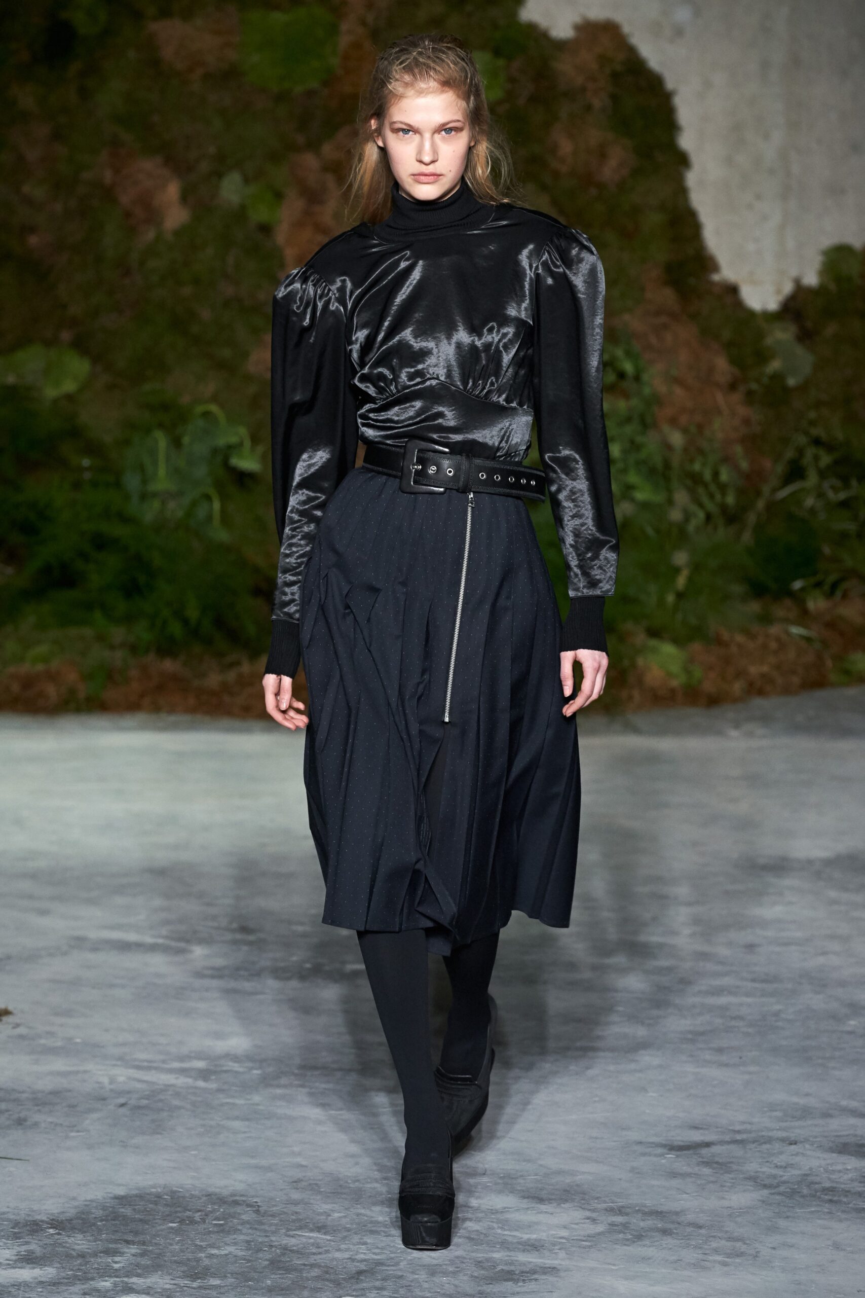 black silk top and pleated skirt