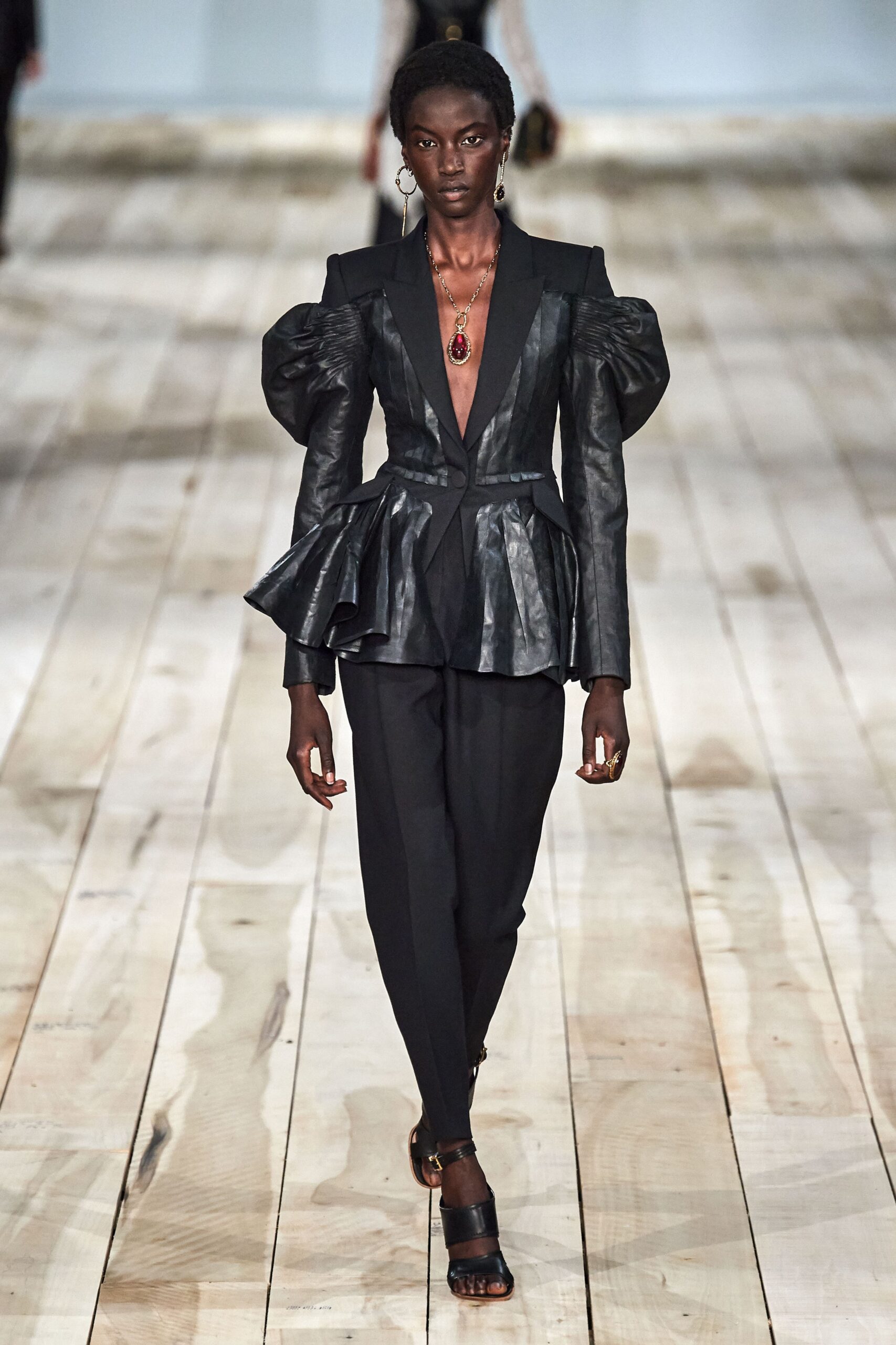 black leather peplum blazer and slim pants