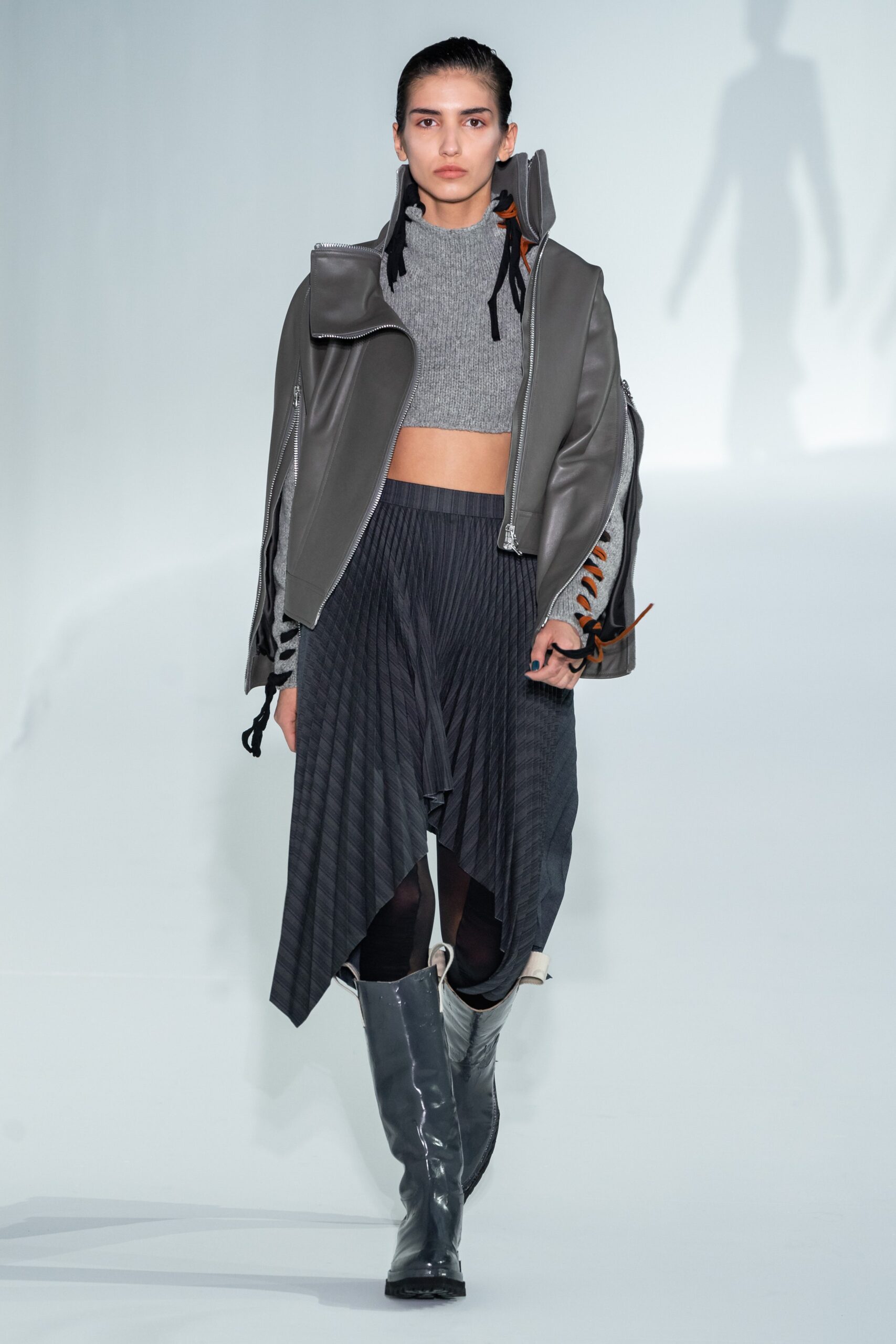 gray leather jacket with pleated skirt