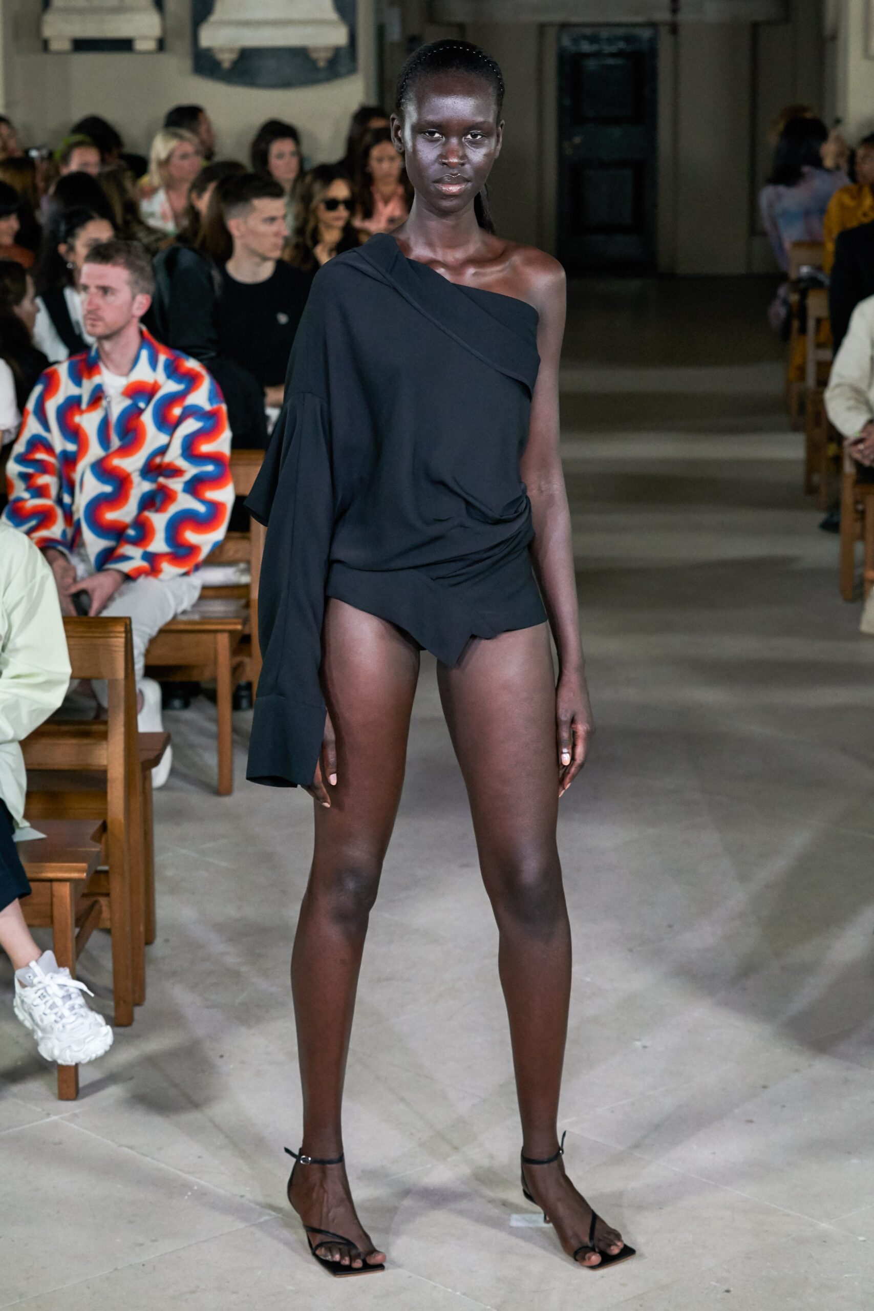 black asymmetric top and shorts