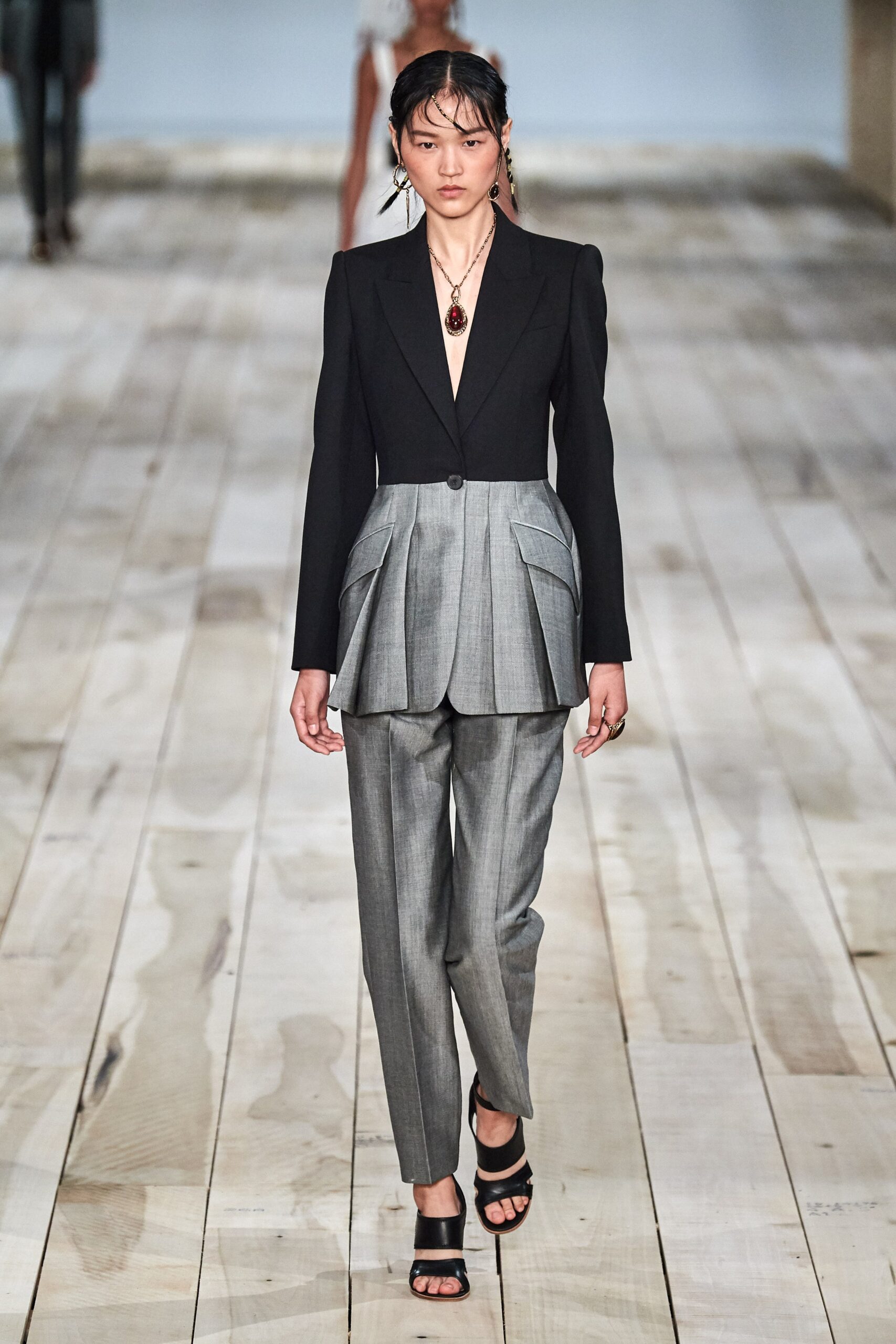 black tailored blazer with gray pants