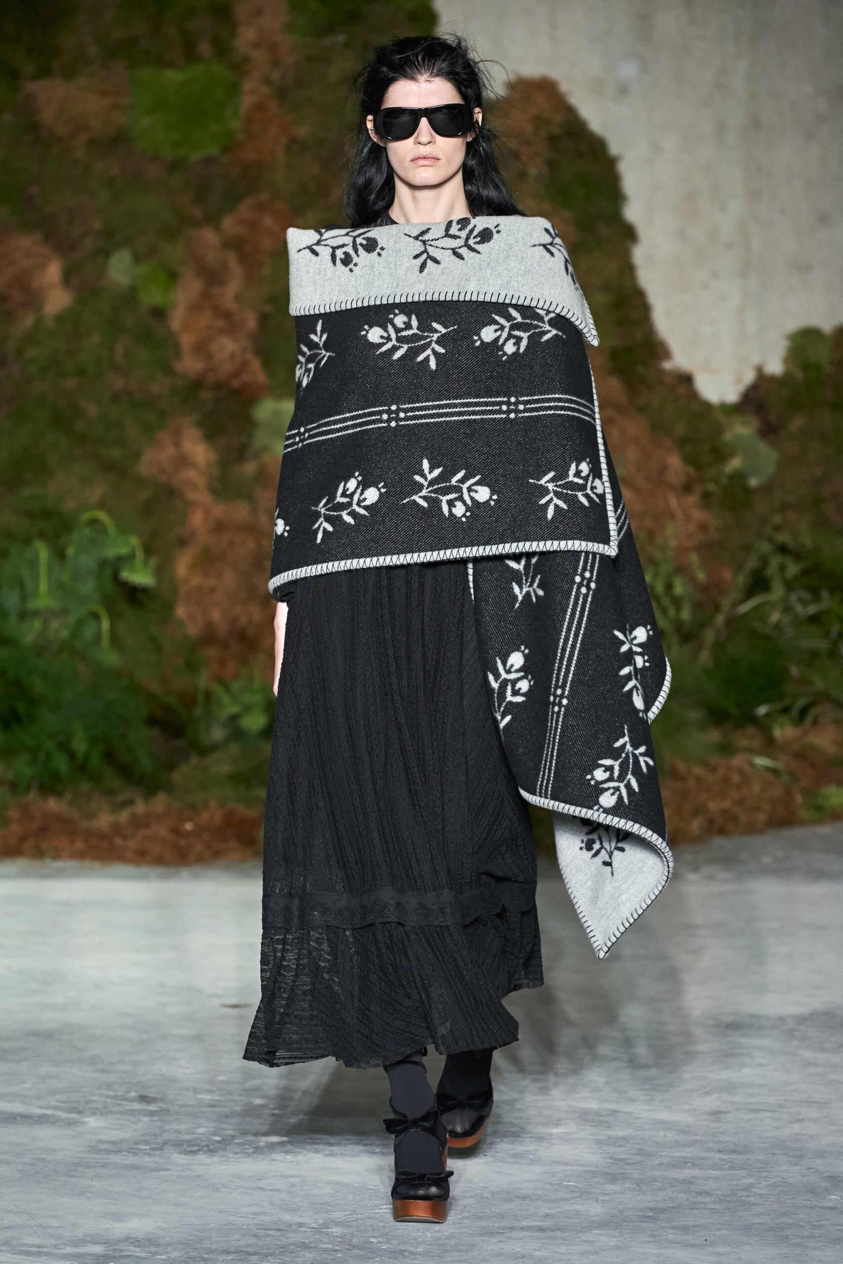 black fitted midi dress with embroidered cape