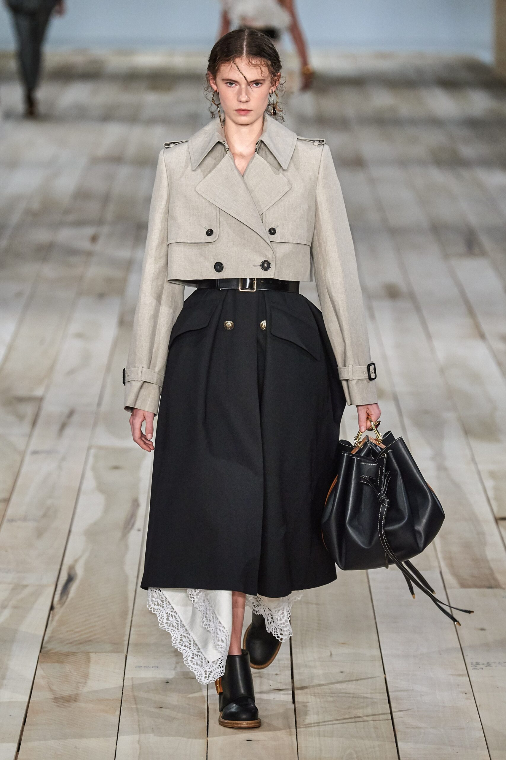 beige coat black pleated skirt