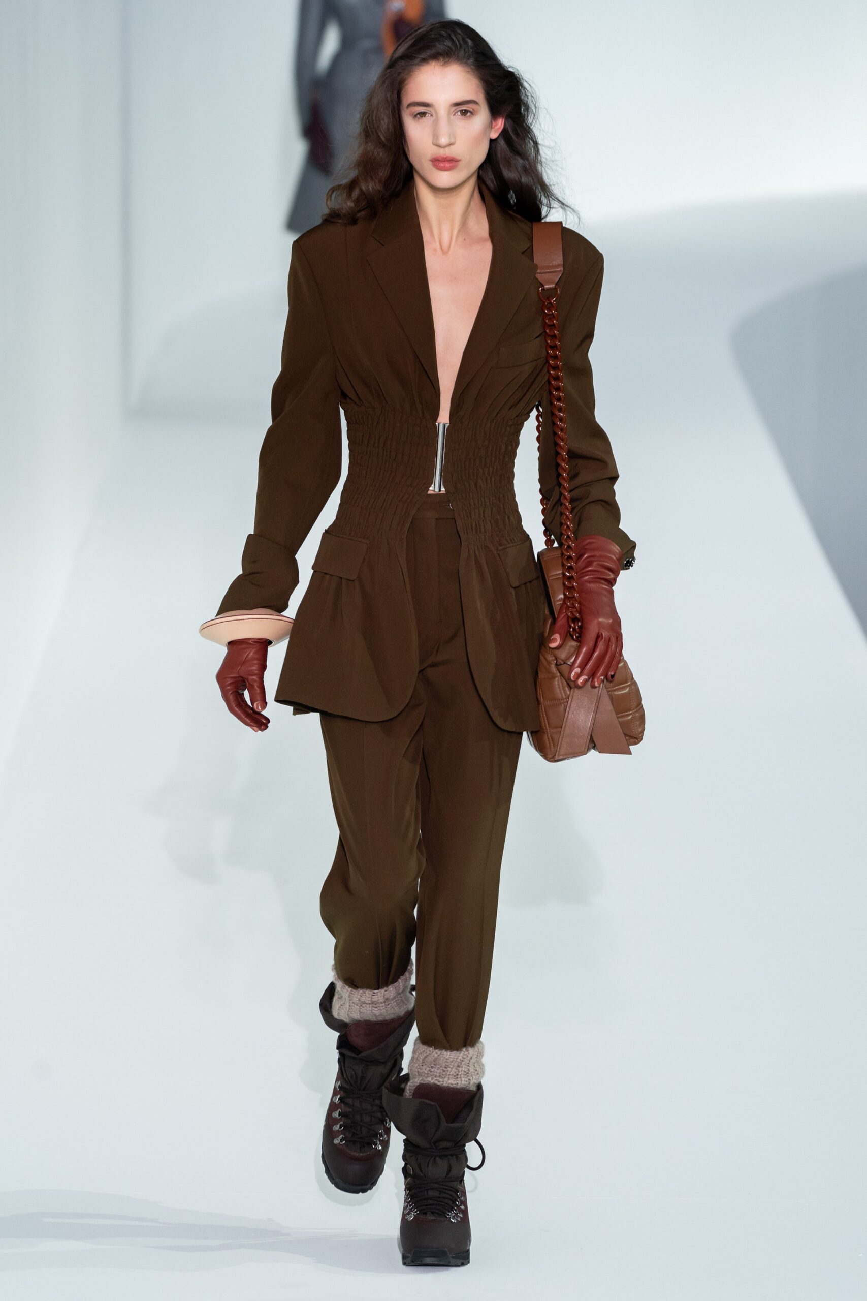 brown fitted suit with gloves