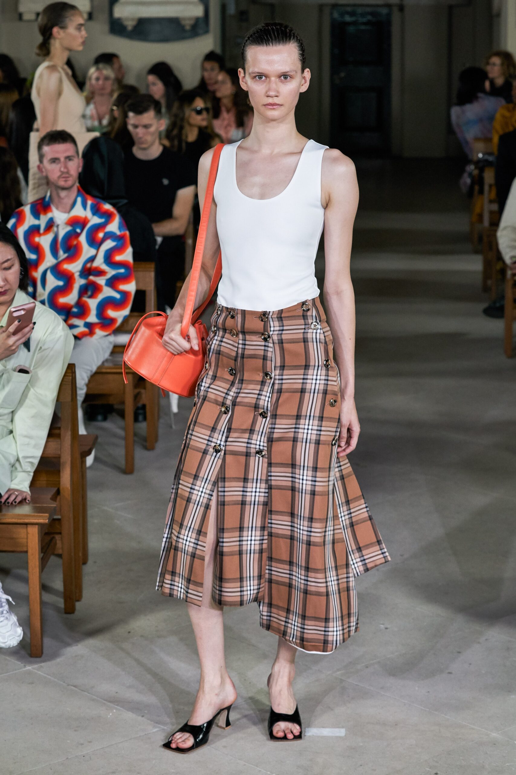 white fitted top with brown asymmetric skirt