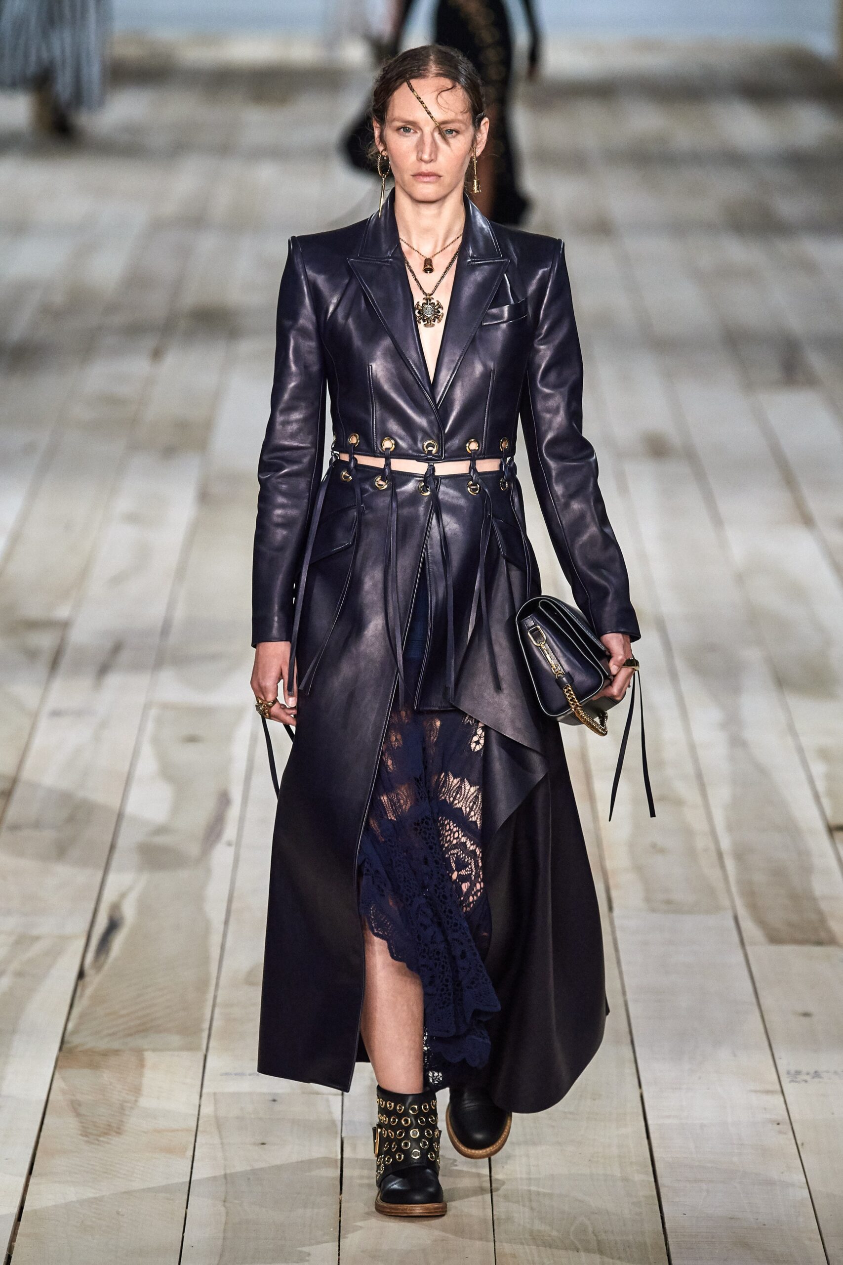 black leather belted coat and navy lace dress