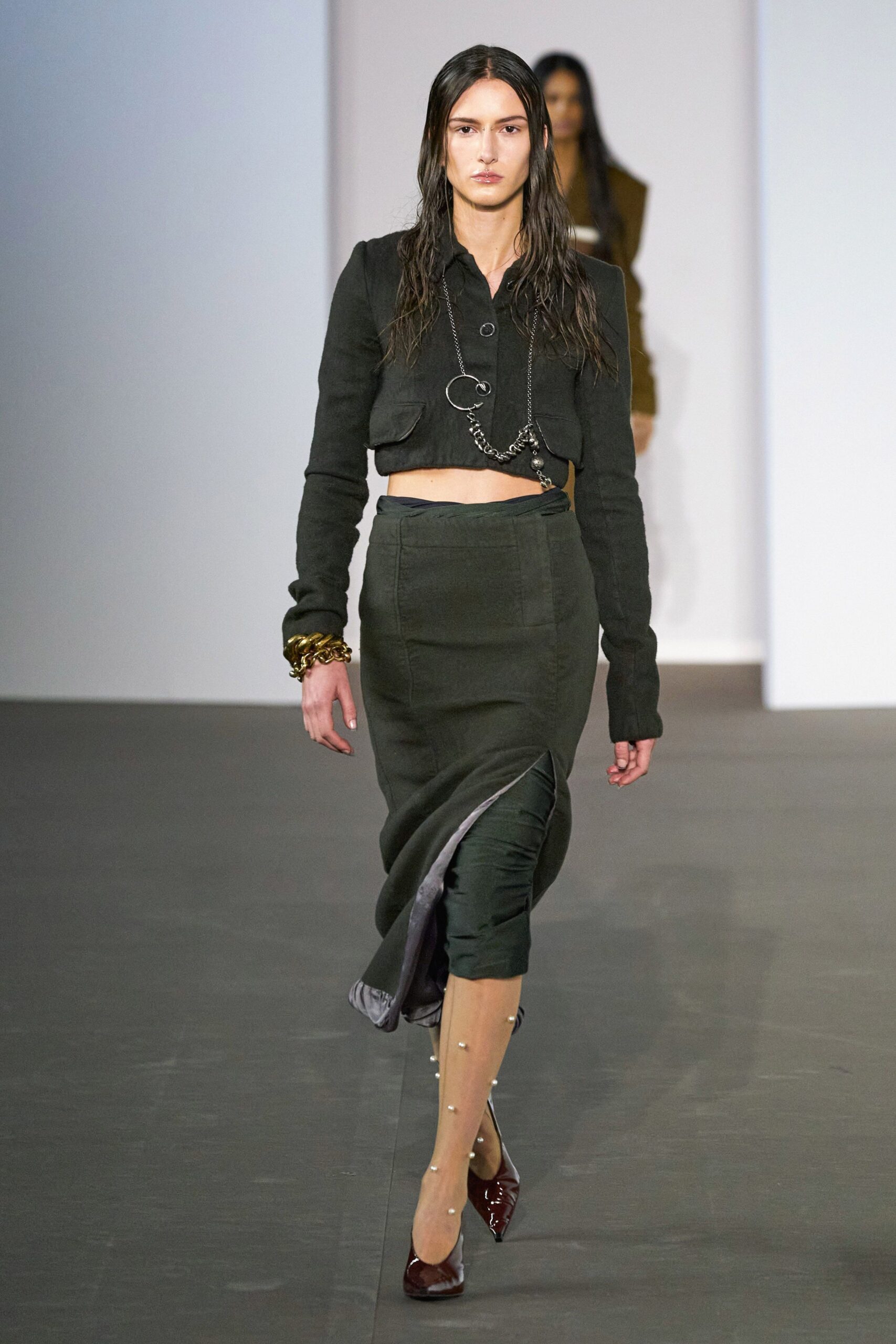 black fitted jacket and green pencil skirt