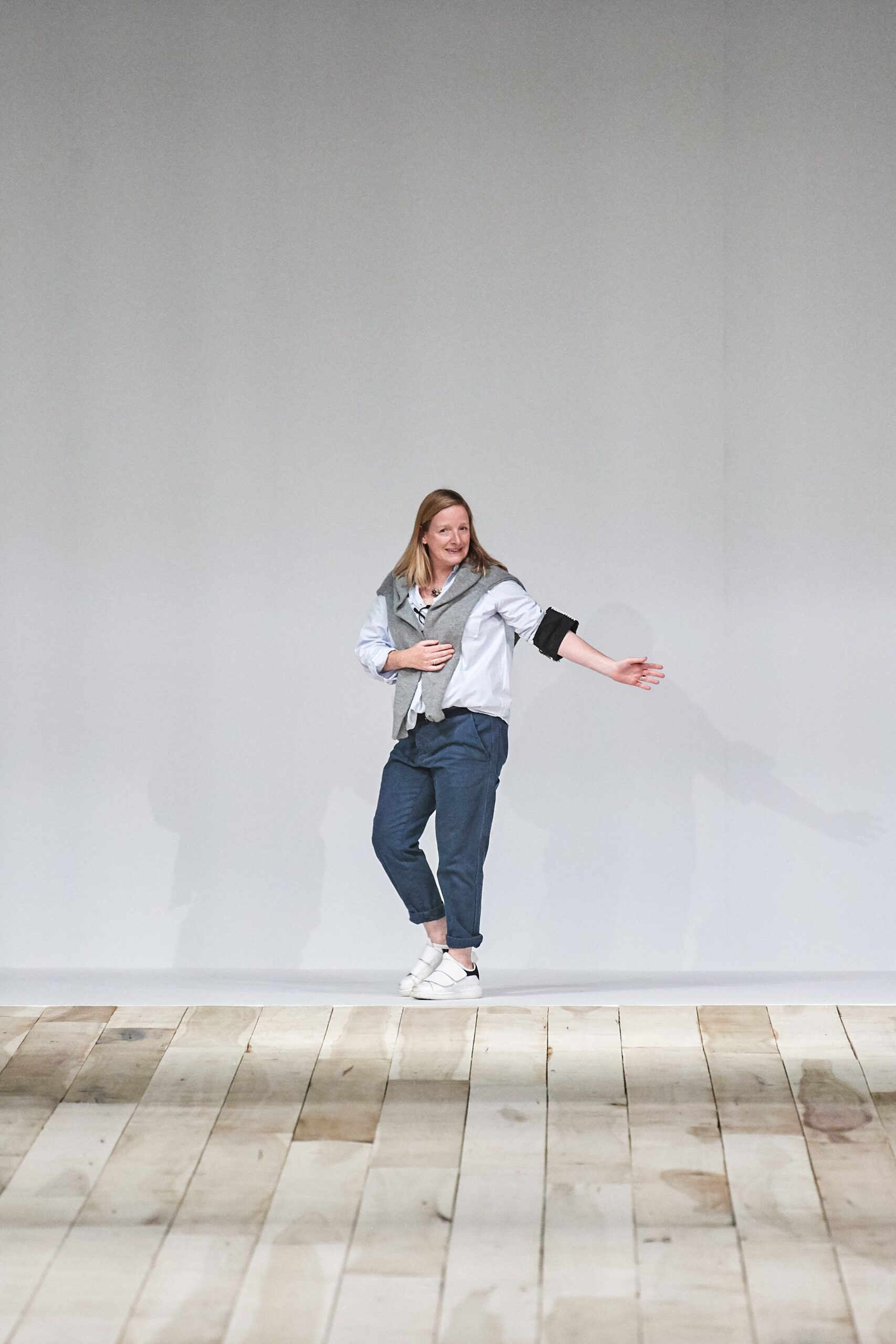 gray relaxed jacket with blue pants
