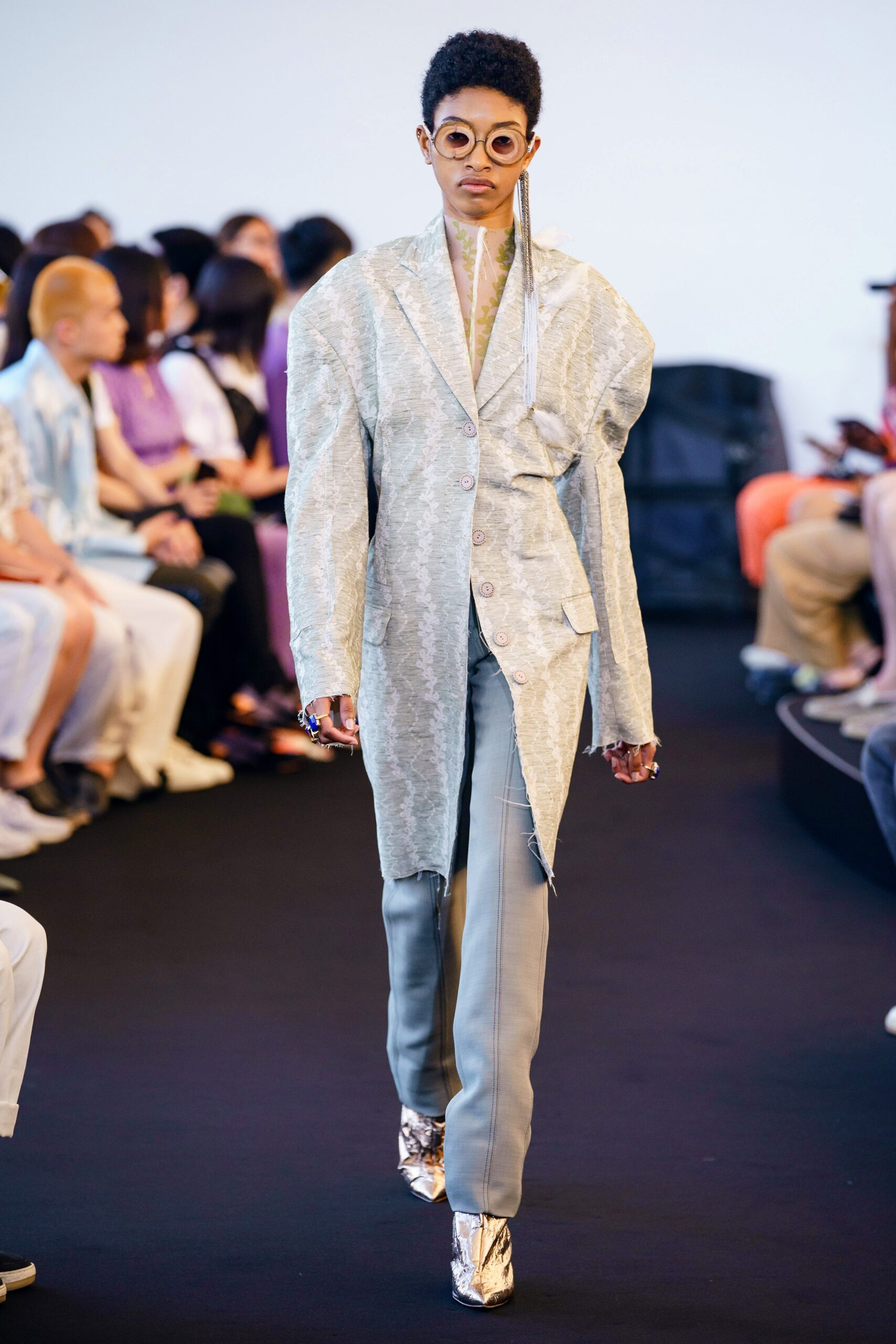 oversized silver jacket with slim gray pants