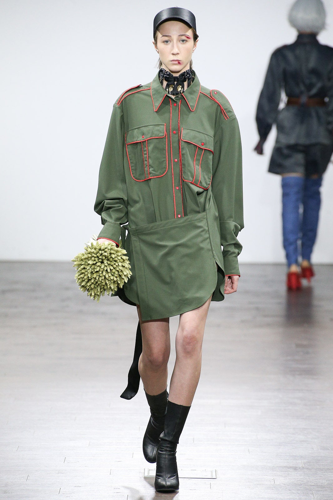 green shirt-dress with red accents