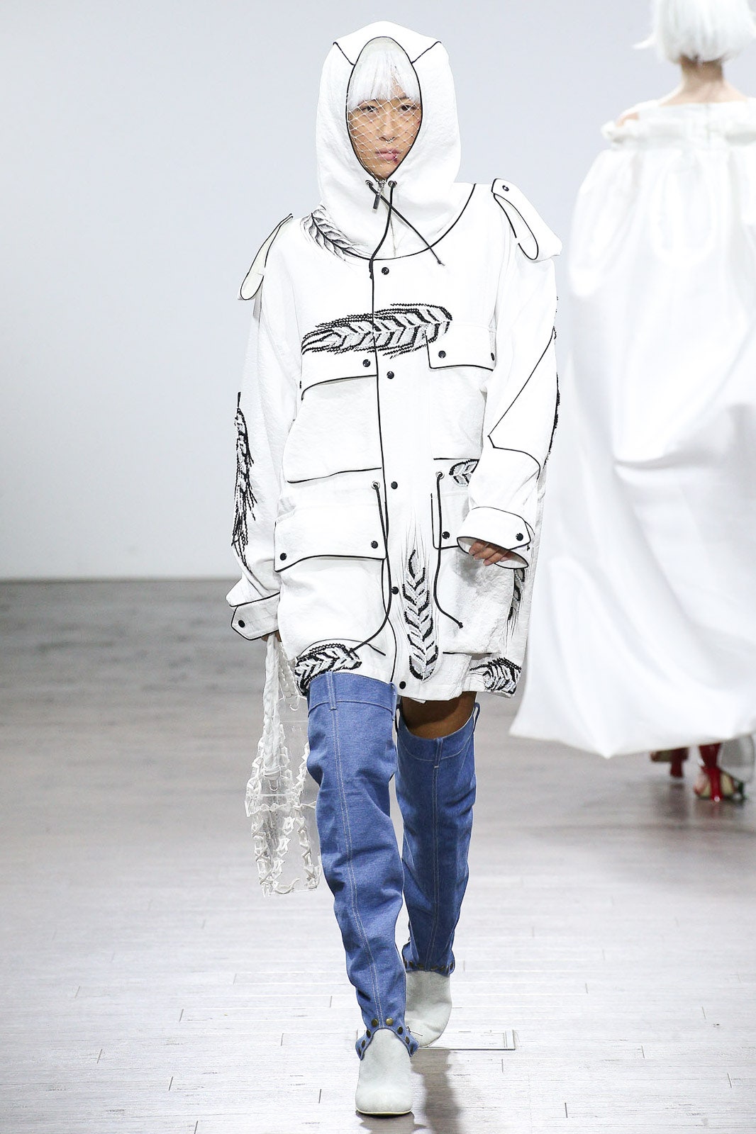 white relaxed jacket with blue pants