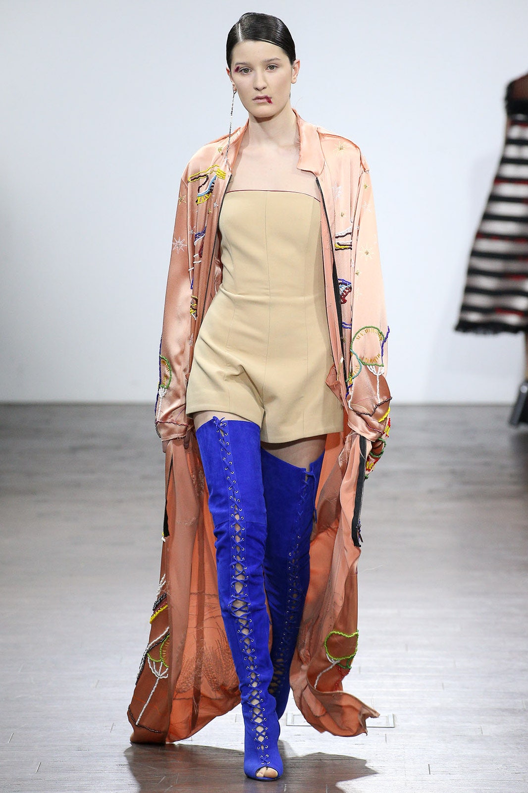 beige romper with pink coat