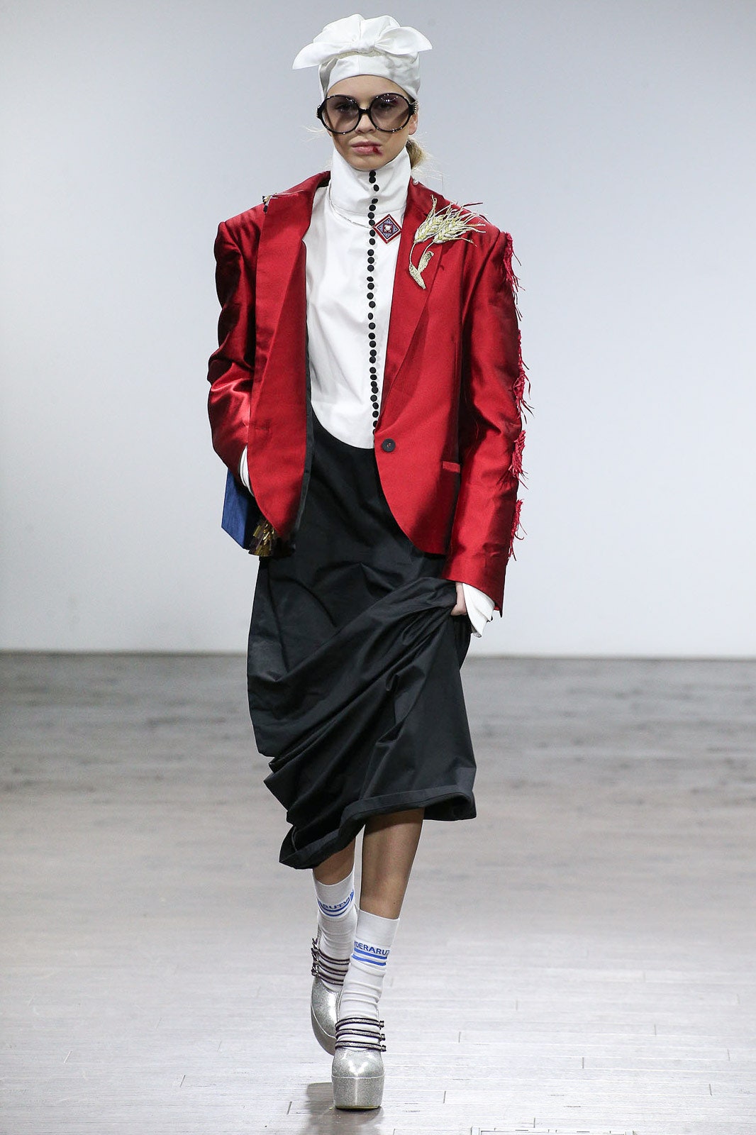 red structured blazer with white shirt