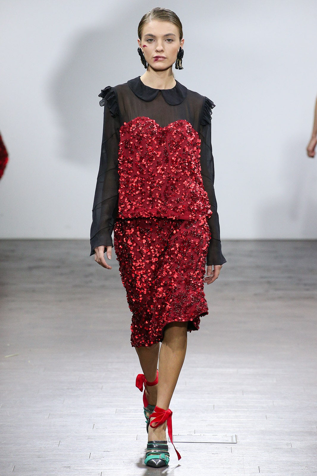 black silk ruffled top with red sequined skirt
