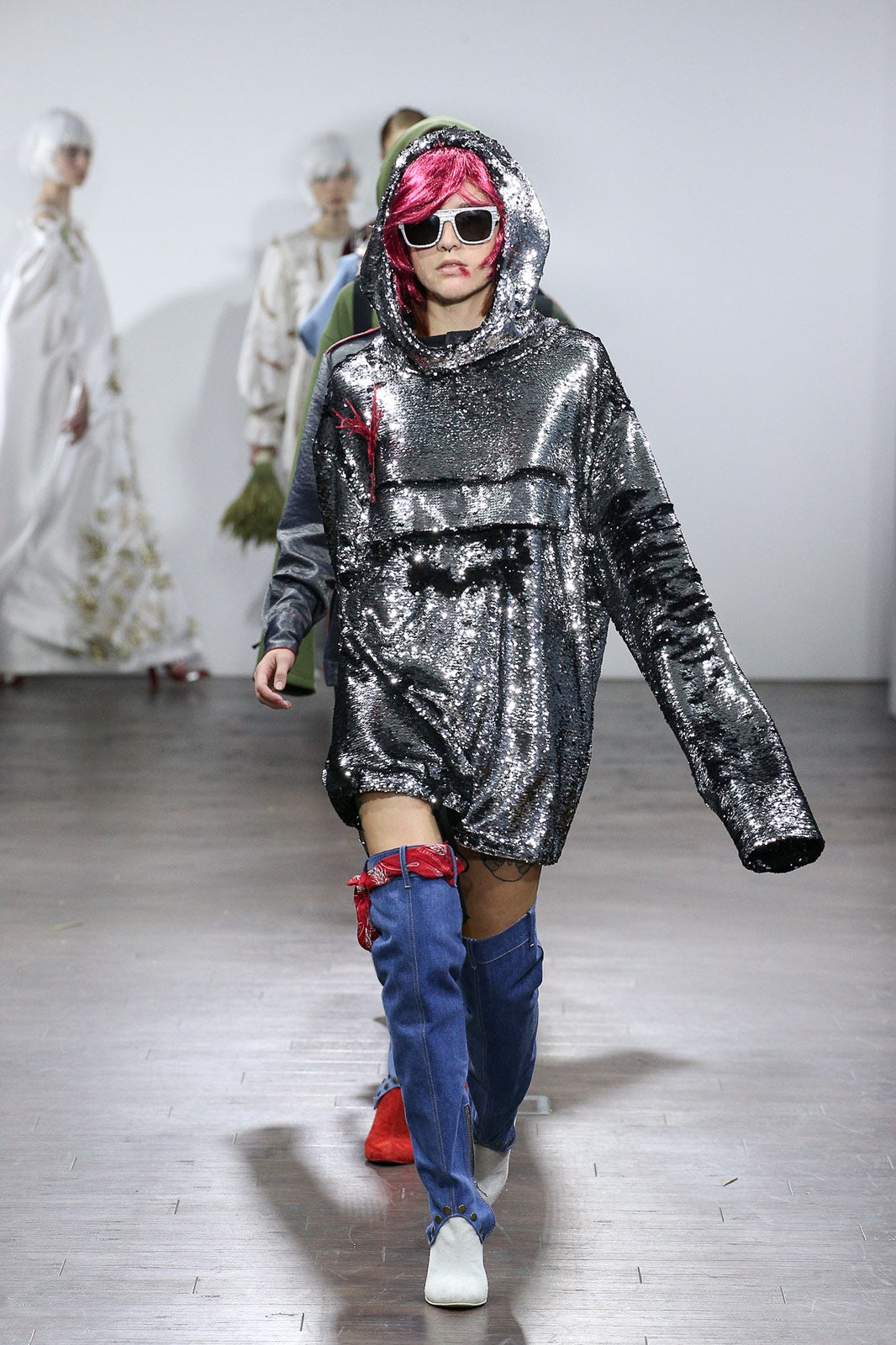 oversized silver sequin hoodie with denim boots
