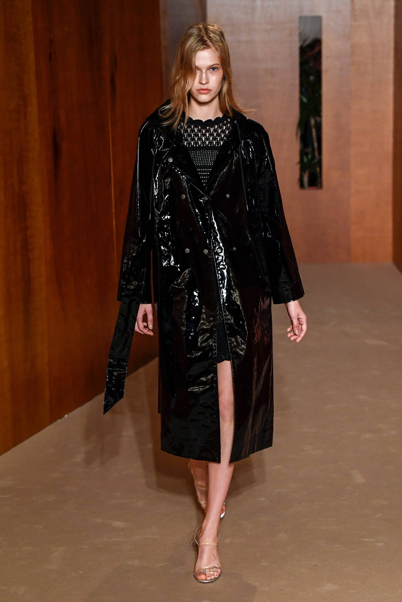 black vinyl long-sleeve collared relaxed zippered shiny coat