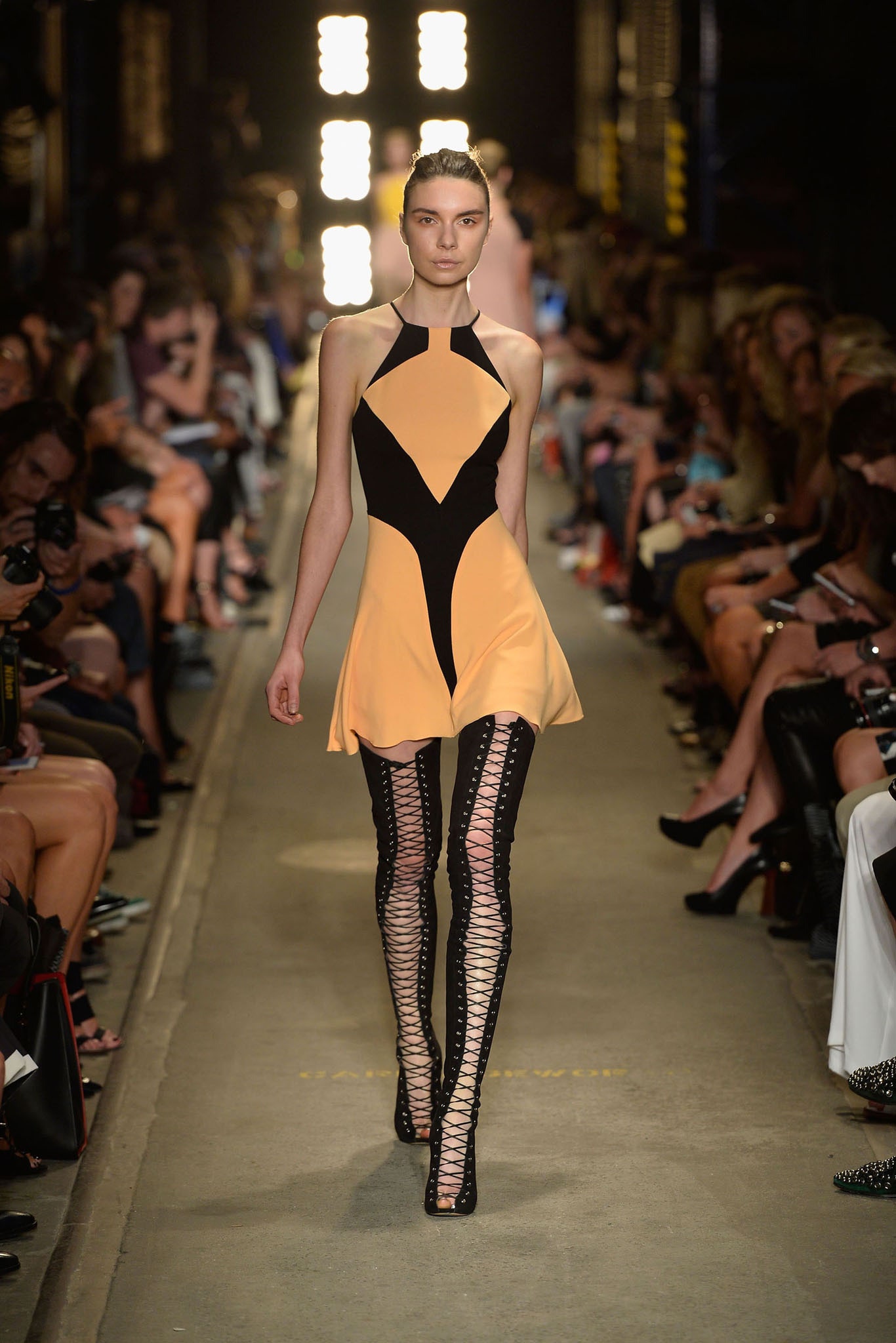 orange and black mini dress with fitted pants