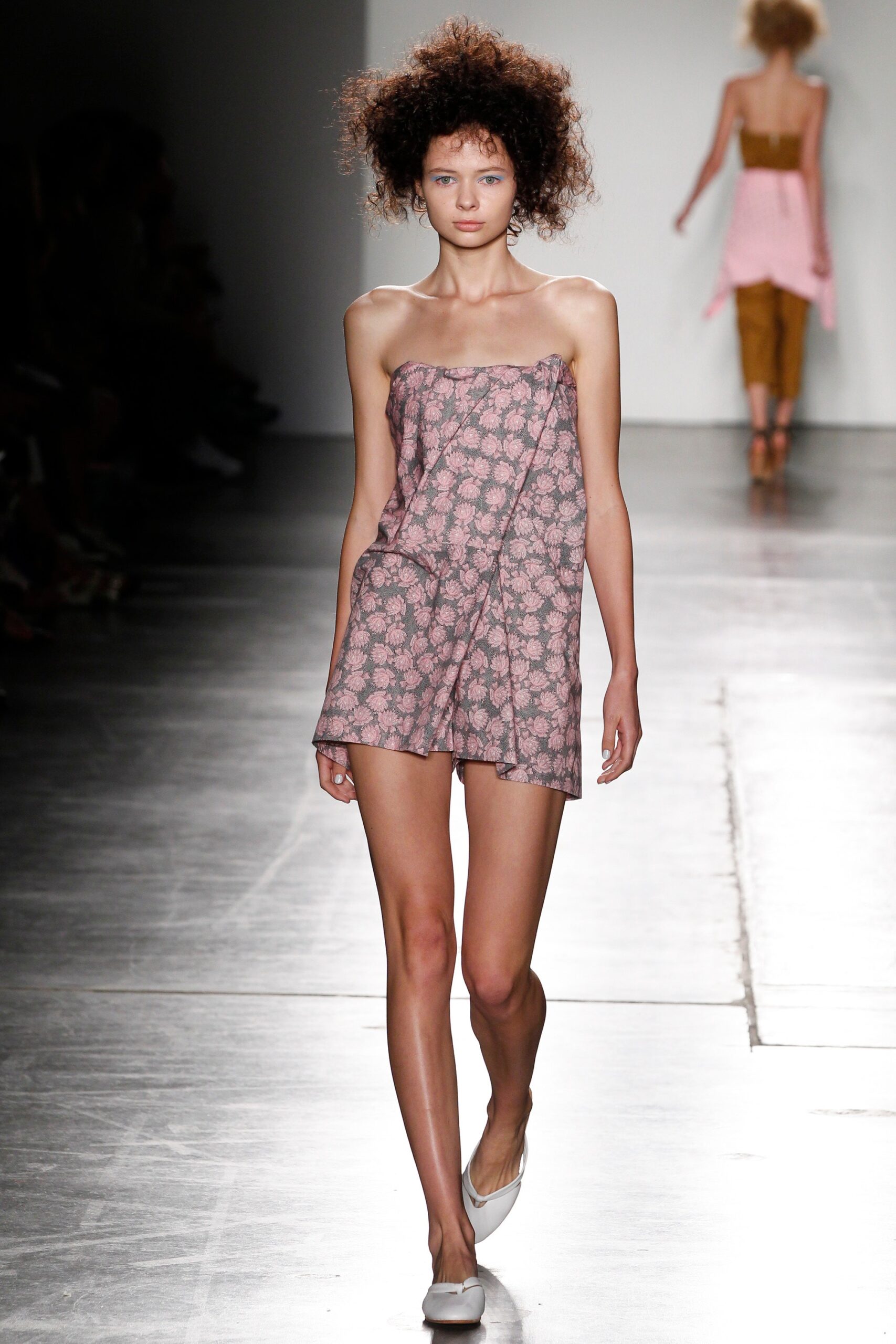 A relaxed pink floral sleeveless dress with a V-neckline.