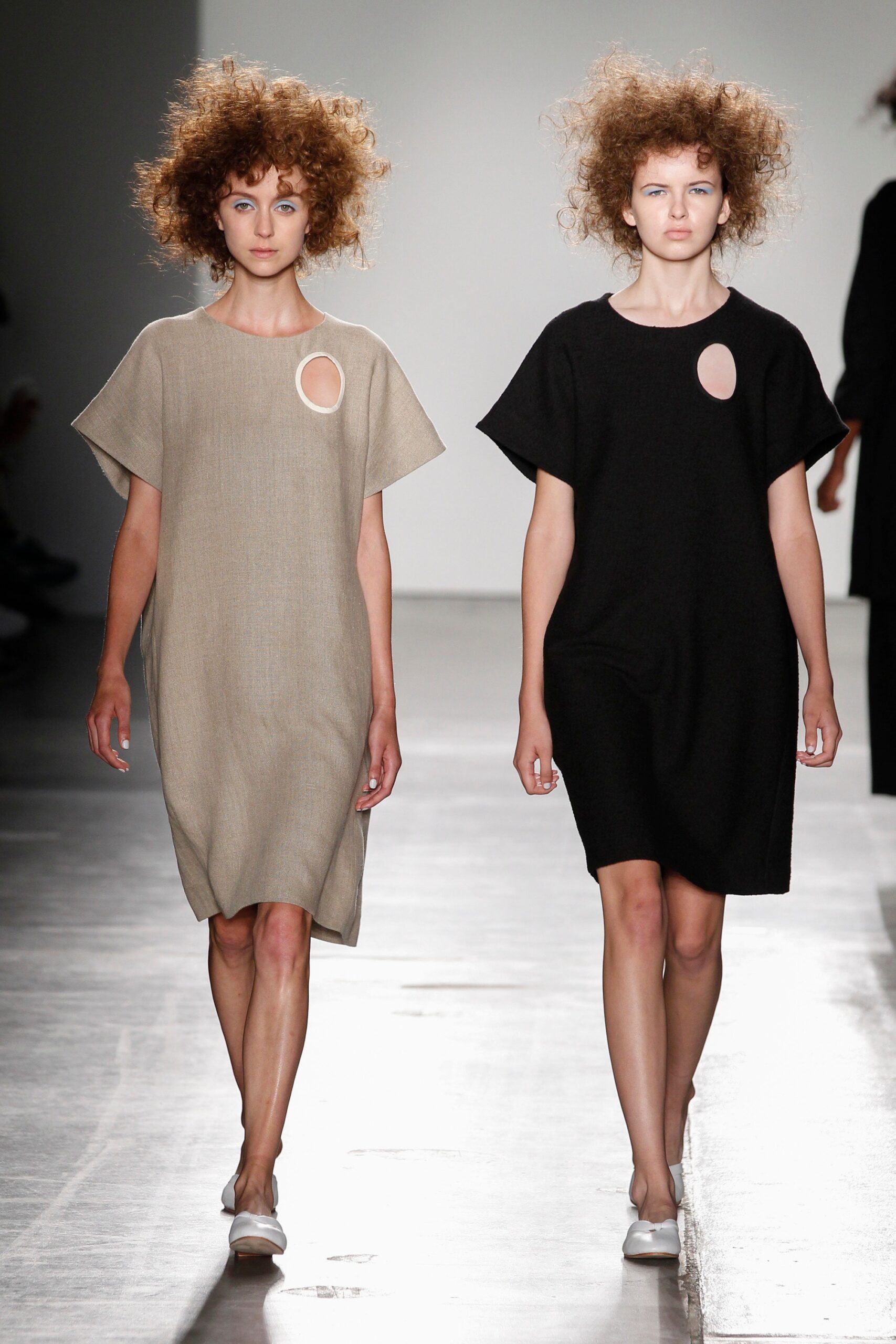 Two relaxed dresses in black and beige with sleeveless design and asymmetric details.