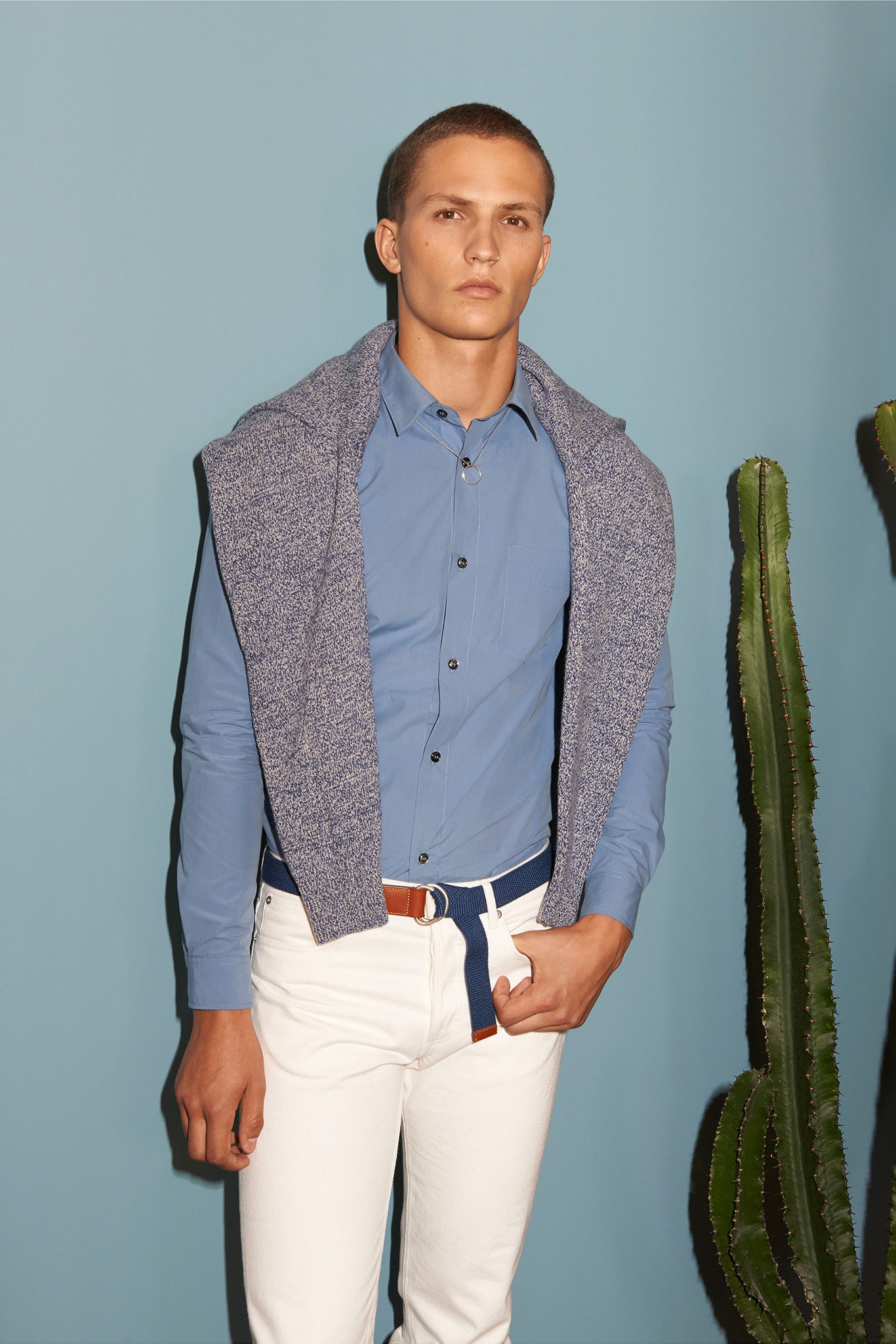 blue fitted shirt with white pants