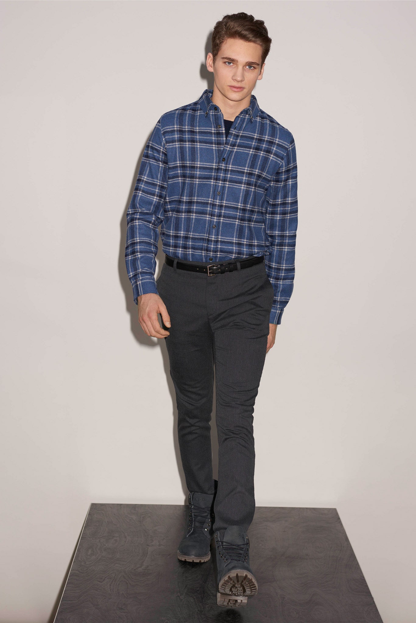 blue checked shirt and gray pants